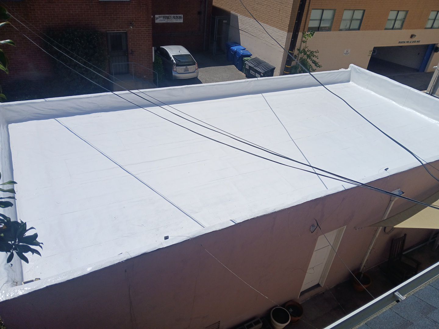 Apartment Building 2nd Layer Installation &Silicone coating by Hull Brothers Roofing