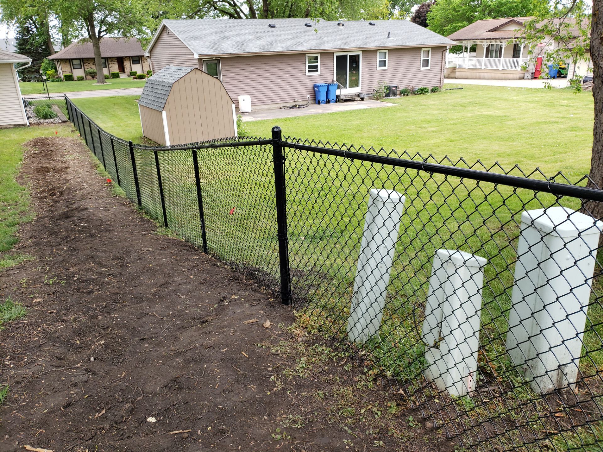 Chain Link and Cedar Privacy in Grundy Center by Perfect Picket Fence and Stain