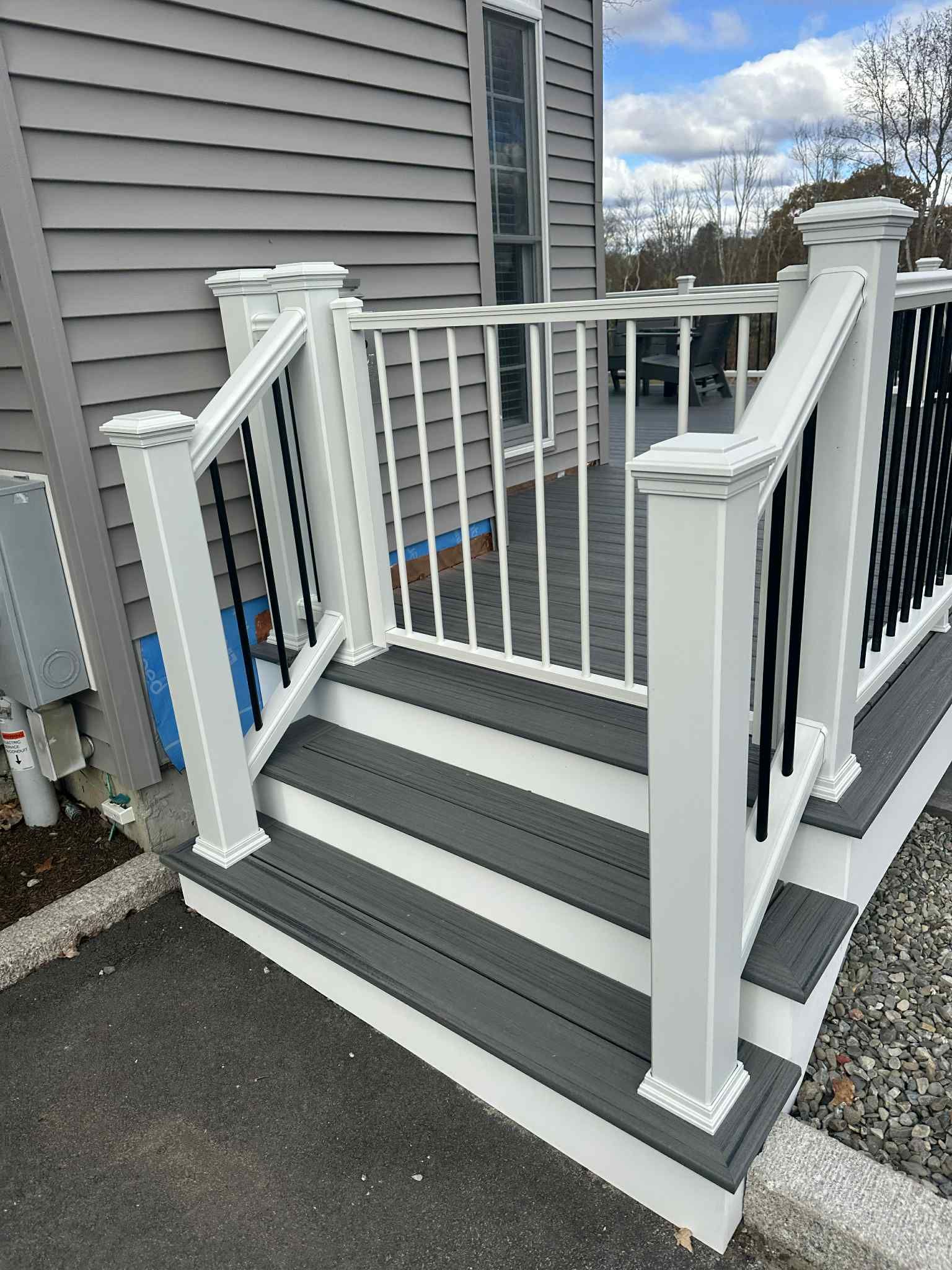 Deck replacement and expansion, With useable under space. Trex Tropical Island mist boards.  by DiGiorgi Roofing and Siding Inc