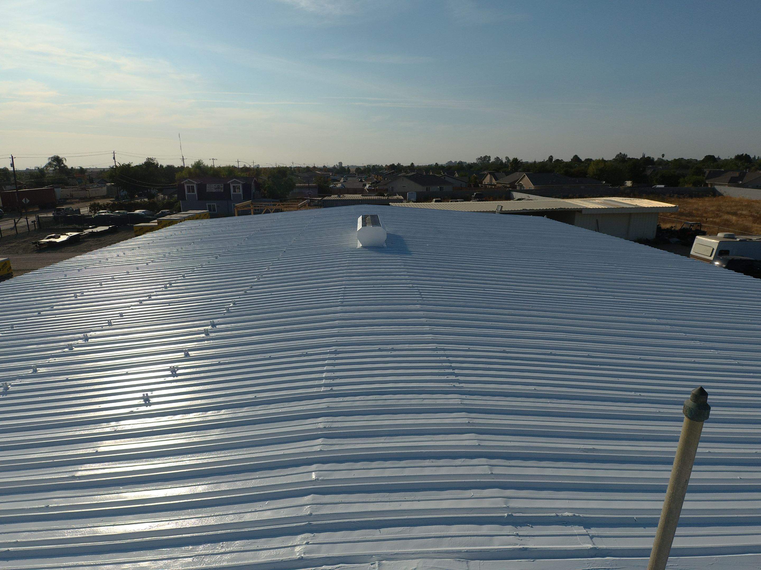 Metal Restoration Roofing system with Benchmark/PUMA XL 20 yr warranty by Straight Edge Roofing Inc