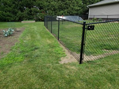 Black Vinyl-Coated Chain Link Fence Installation in Fredericksburg