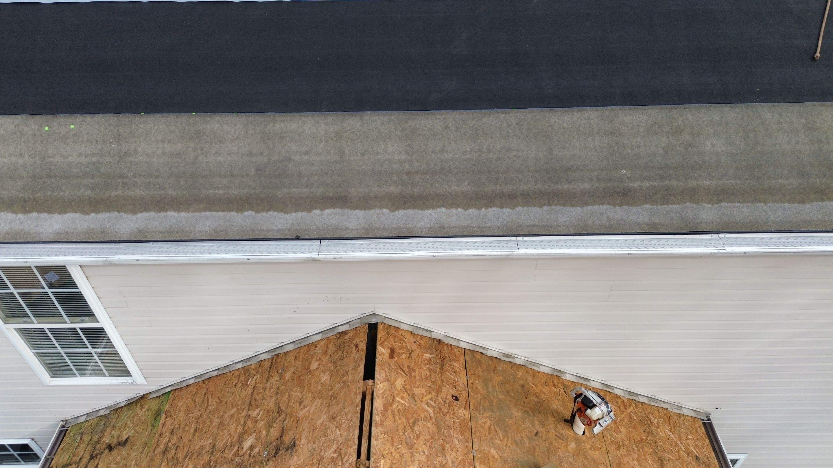 Walden Ponds - Pristine Black and Hydro Flo Gutter Guards by Tamlin Roofing