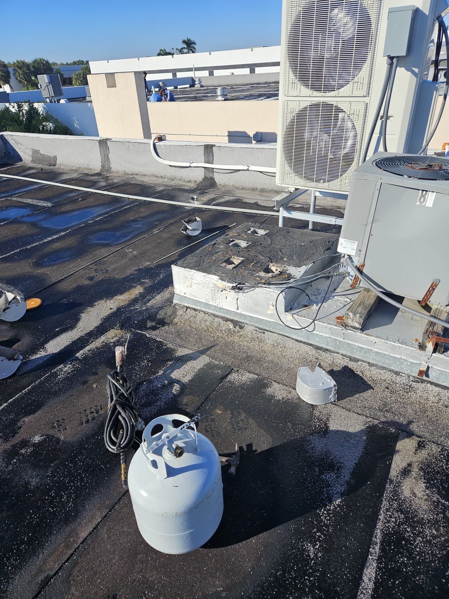 Commercial Roofing Repair using Roof Sealant by Four Peaks Roofing