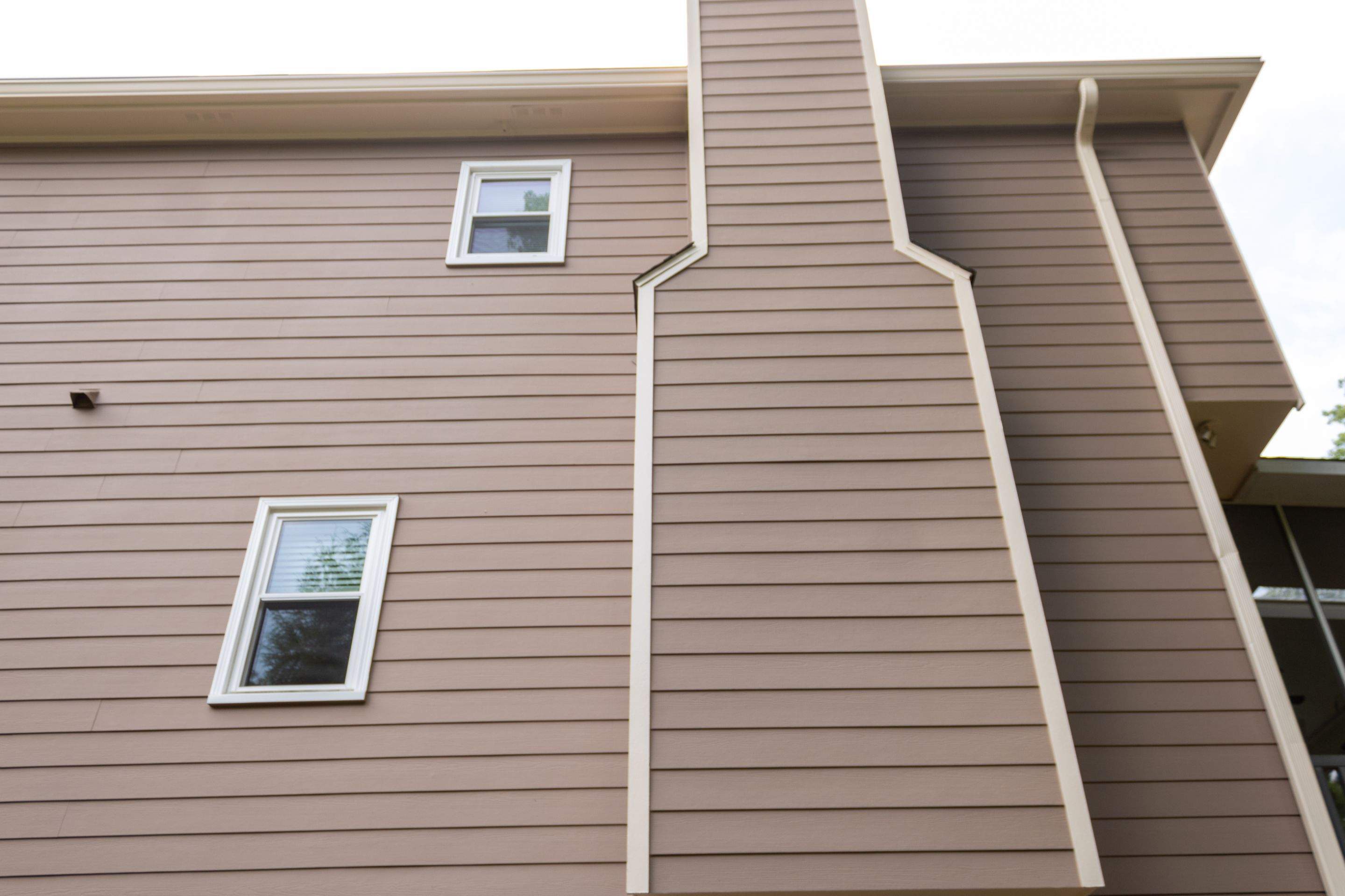Exterior Painting using Sherwin-Williams and Rotted Wood Replacement by Nelson Exteriors 