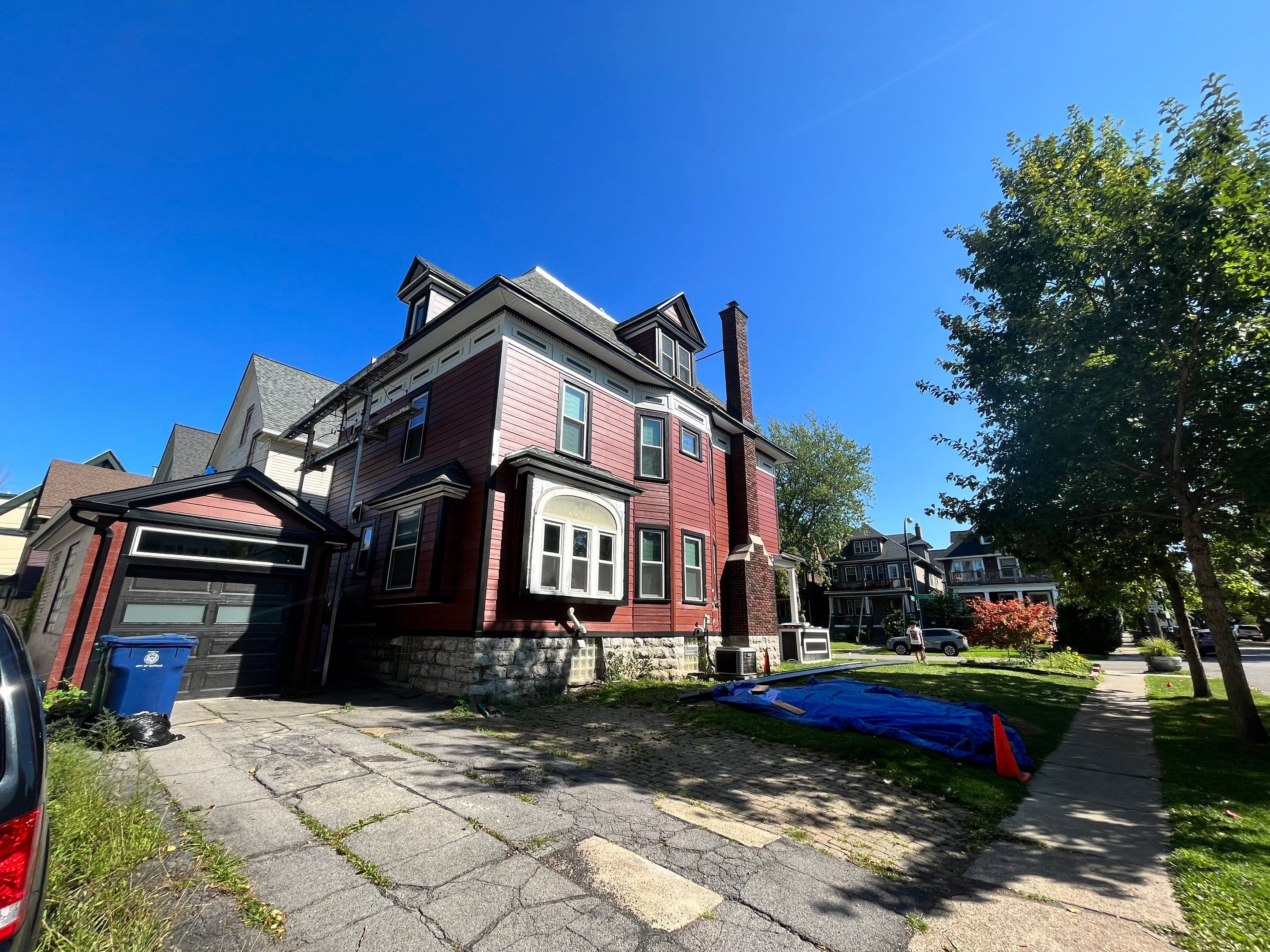 Exterior Renovations- Siding, Stamped Concrete, Porch, and Railings by Ivy Lea Construction