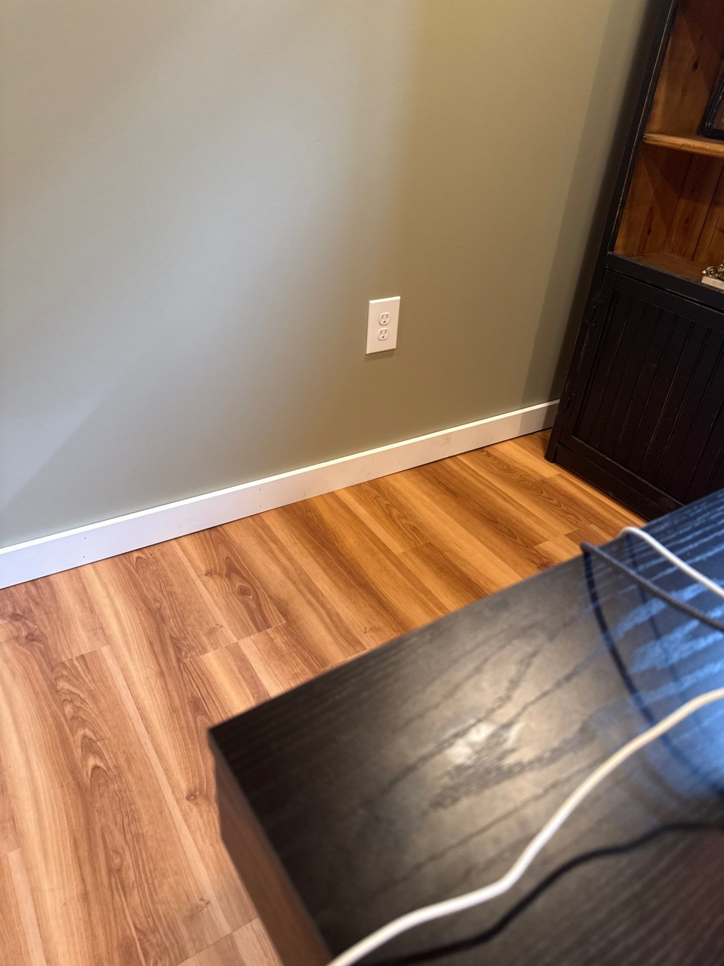 Lincoln Basement Office Renovation with Sage Green Walls and Laminate Flooring by CompanyCam Sales Demo
