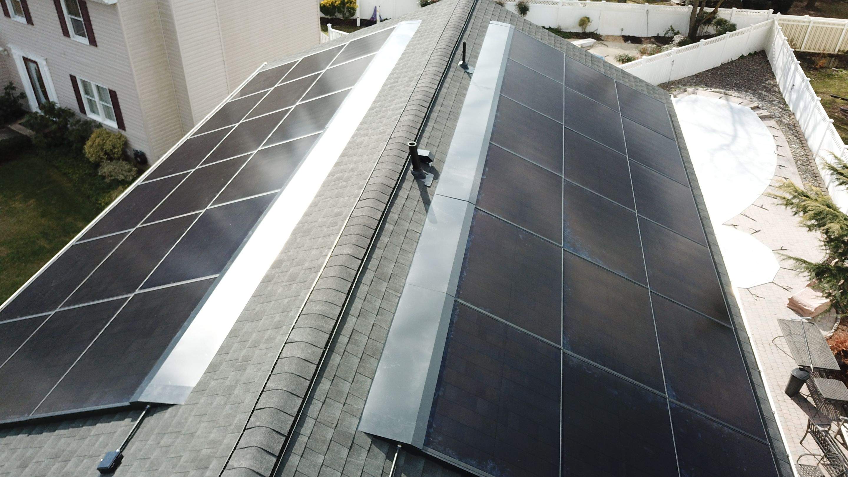 Roof Replacement with GAF Decotech integrated solar panels by American Home Contractors