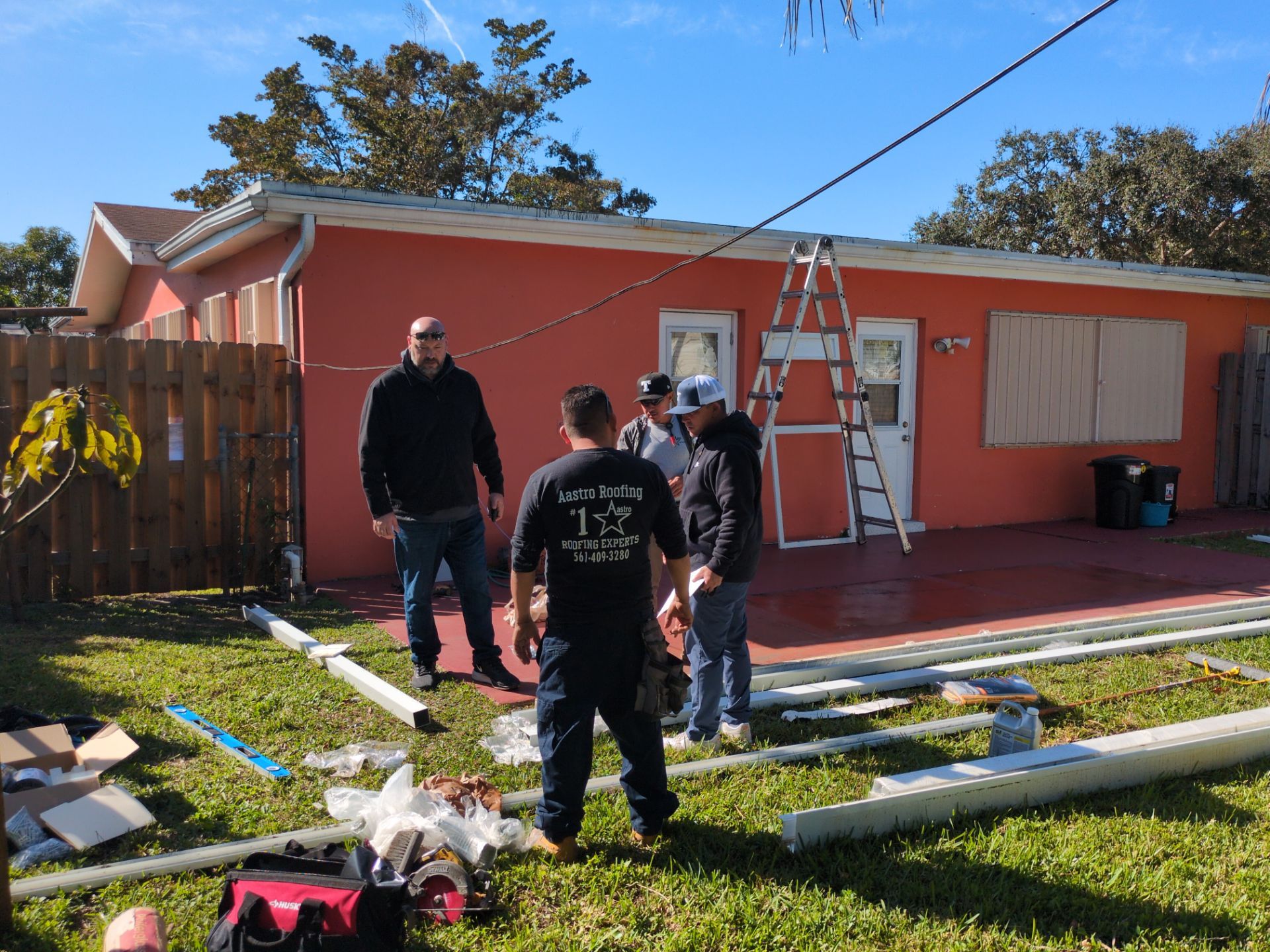 Insulated Screen Enclosure and Wood Tile Deck Installation in Plantation by Aastro Roofing
