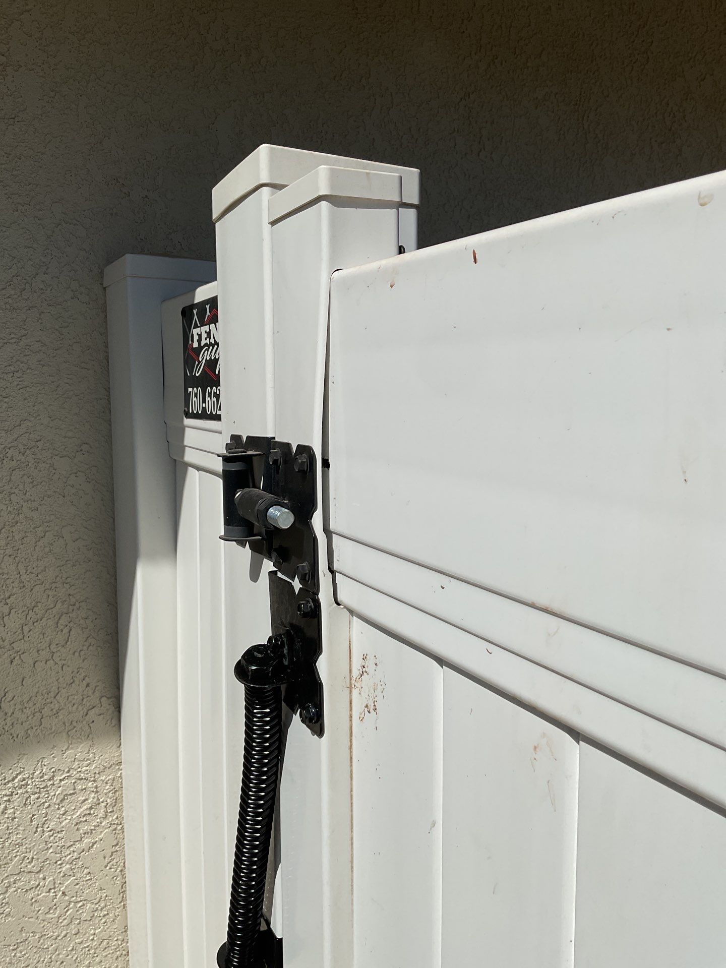 Gate installation using Vinyl by Fence Guys Inc. 