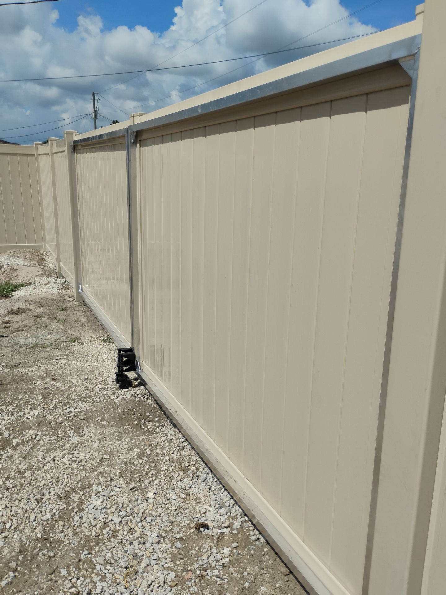 Tan Vinyl Privacy Fence and Gate Installation in North Port by True Fence LLC
