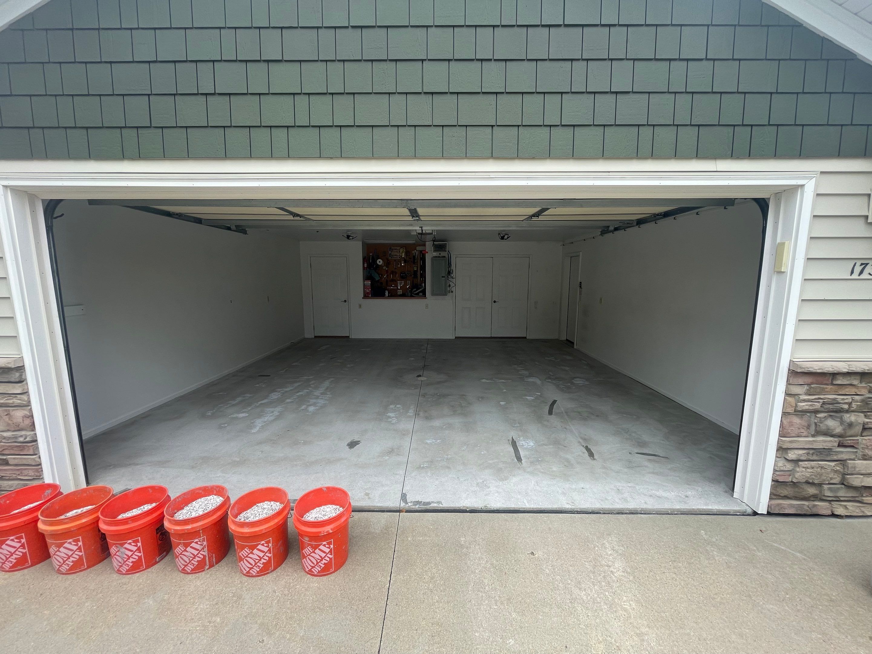 Coyote Flake Garage Floor Coating in Worthington, Minnesota by Select Painting, Coatings & Garage Cabinets