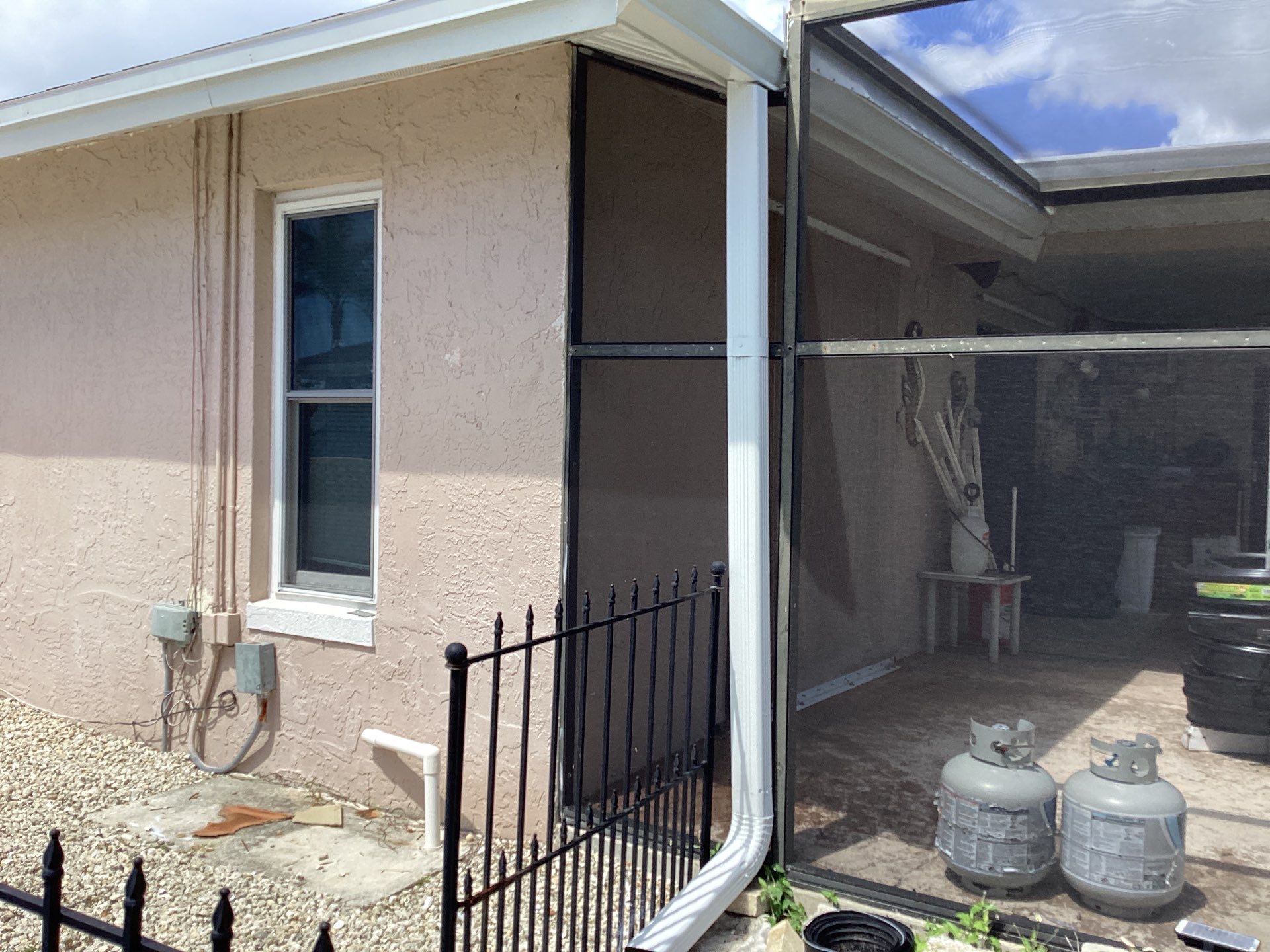 White Seamless Gutters and Splash Guards in Fort Myers FL by Gutter Professor by Gutter Professors