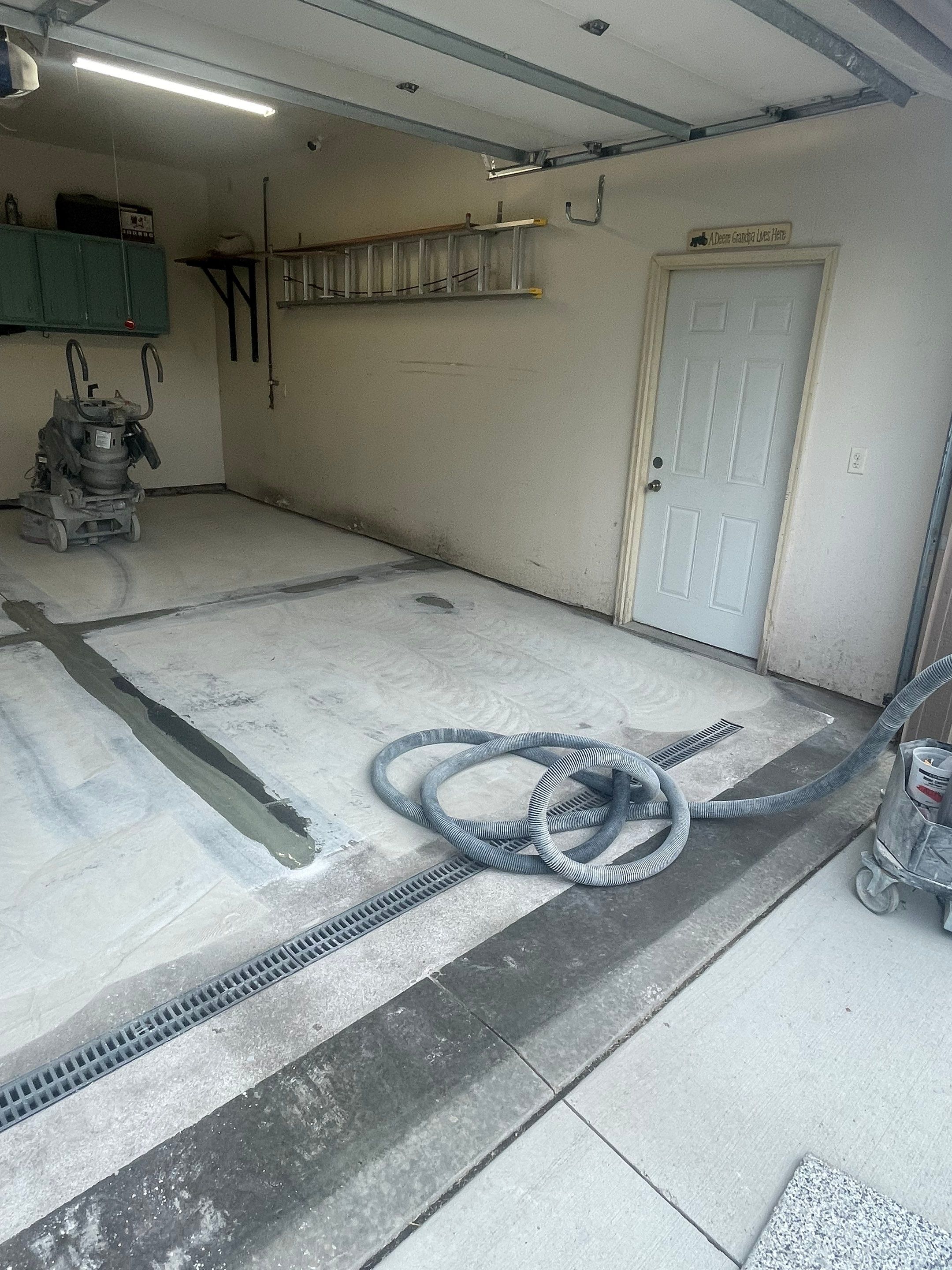 Multi-Stall Garage Floor Coating Installation in Sioux Falls by Select Painting, Coatings & Garage Cabinets