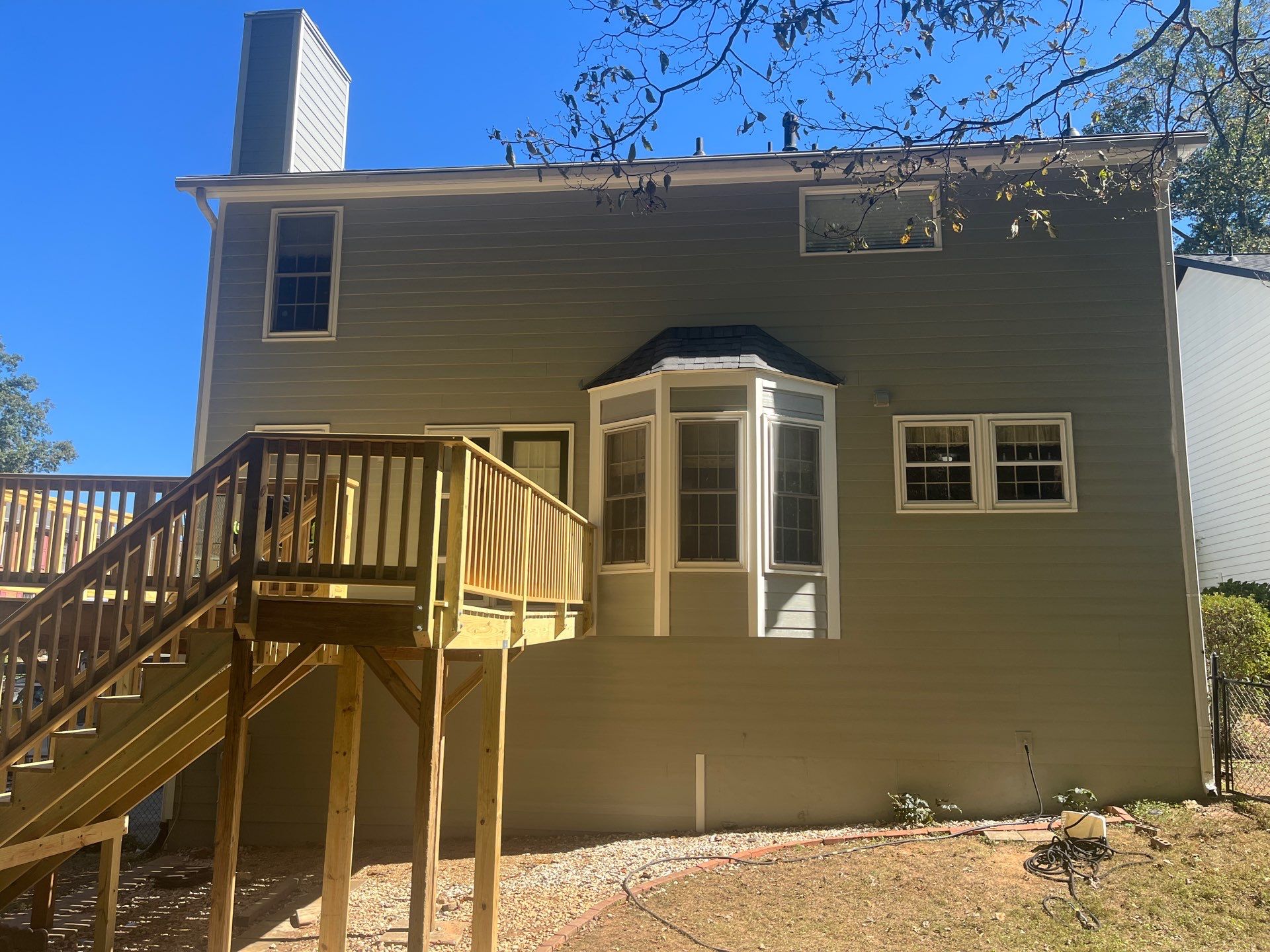 James Hardie Siding Replacement and Pressure Treated Pine Deck Resurface  by Nelson Exteriors 