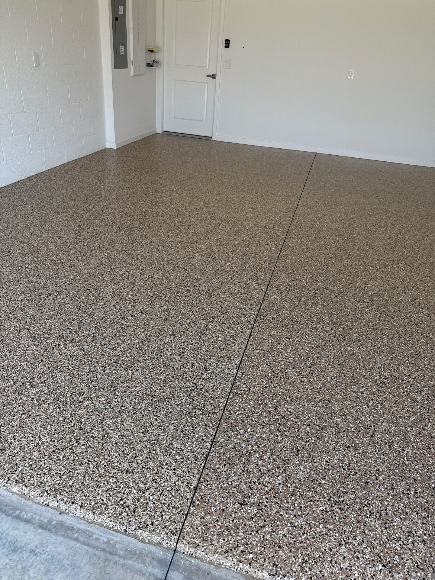 Garage and Lanai With Exterior Pad in Sandstone  by Innovative Concrete Coatings 