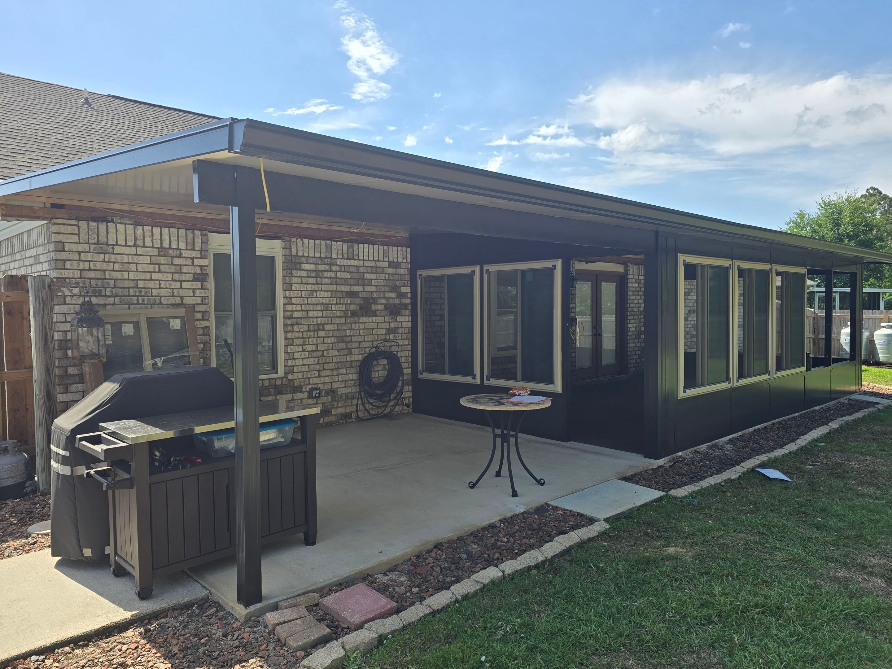 Glass Room & Patio Cover using Colorbeam by Titan Sunrooms