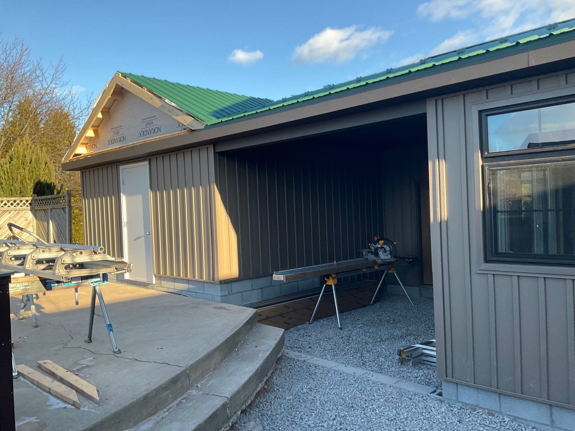 Multi-Story Residential Addition Featuring Textured Metal Siding in Millersburg by Esh Builders