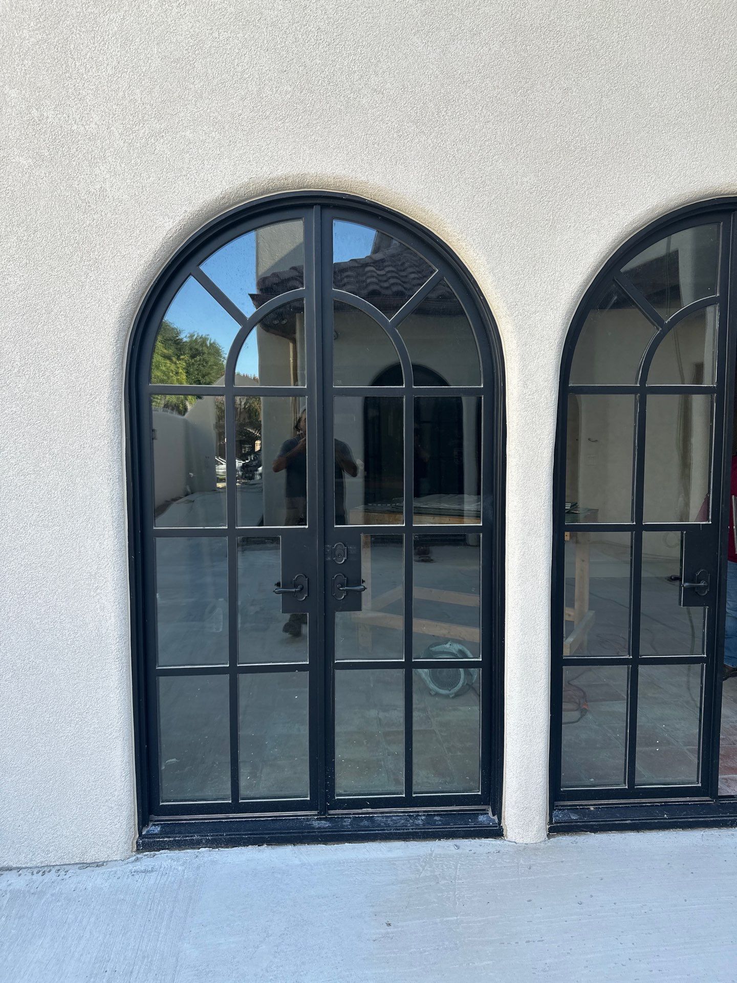 Arched Black Metal French Door Installation and Finishing in Fort Worth by Solara Custom Living