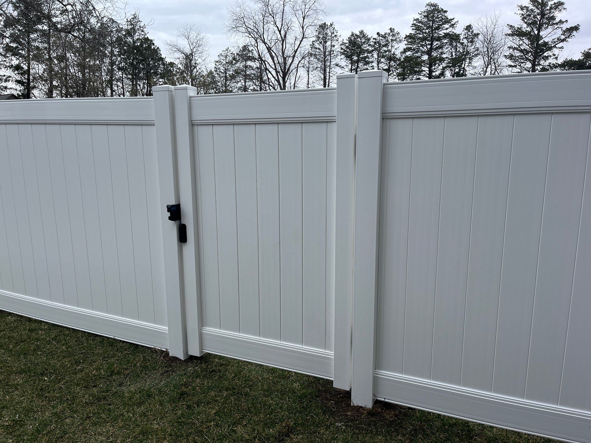 White Vinyl Privacy and Black Chain Link Fencing in Buckingham by Perfect Picket Fence and Stain