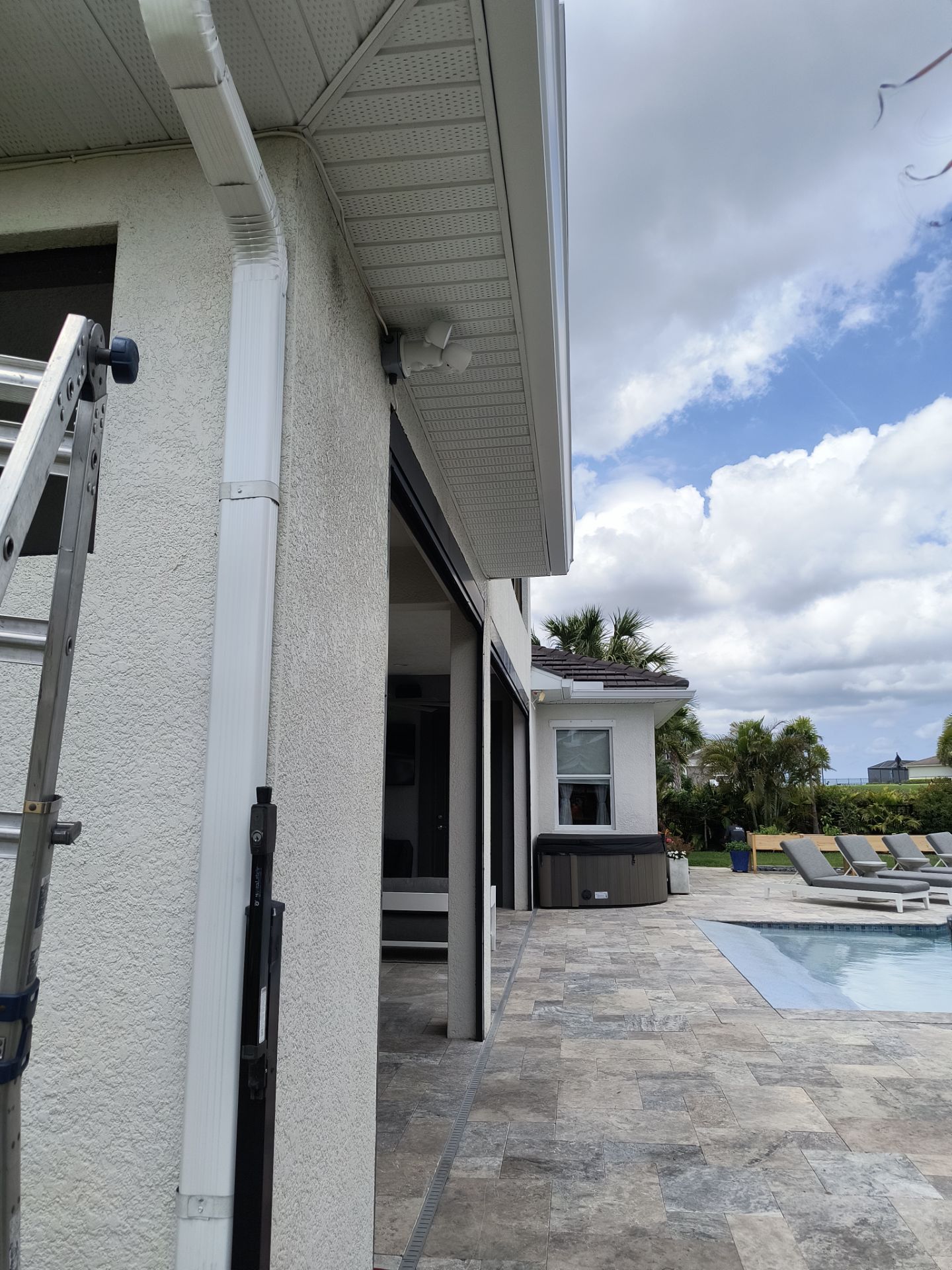 White Seamless Gutters with Downspouts in Bradenton FL by Gutter Professors