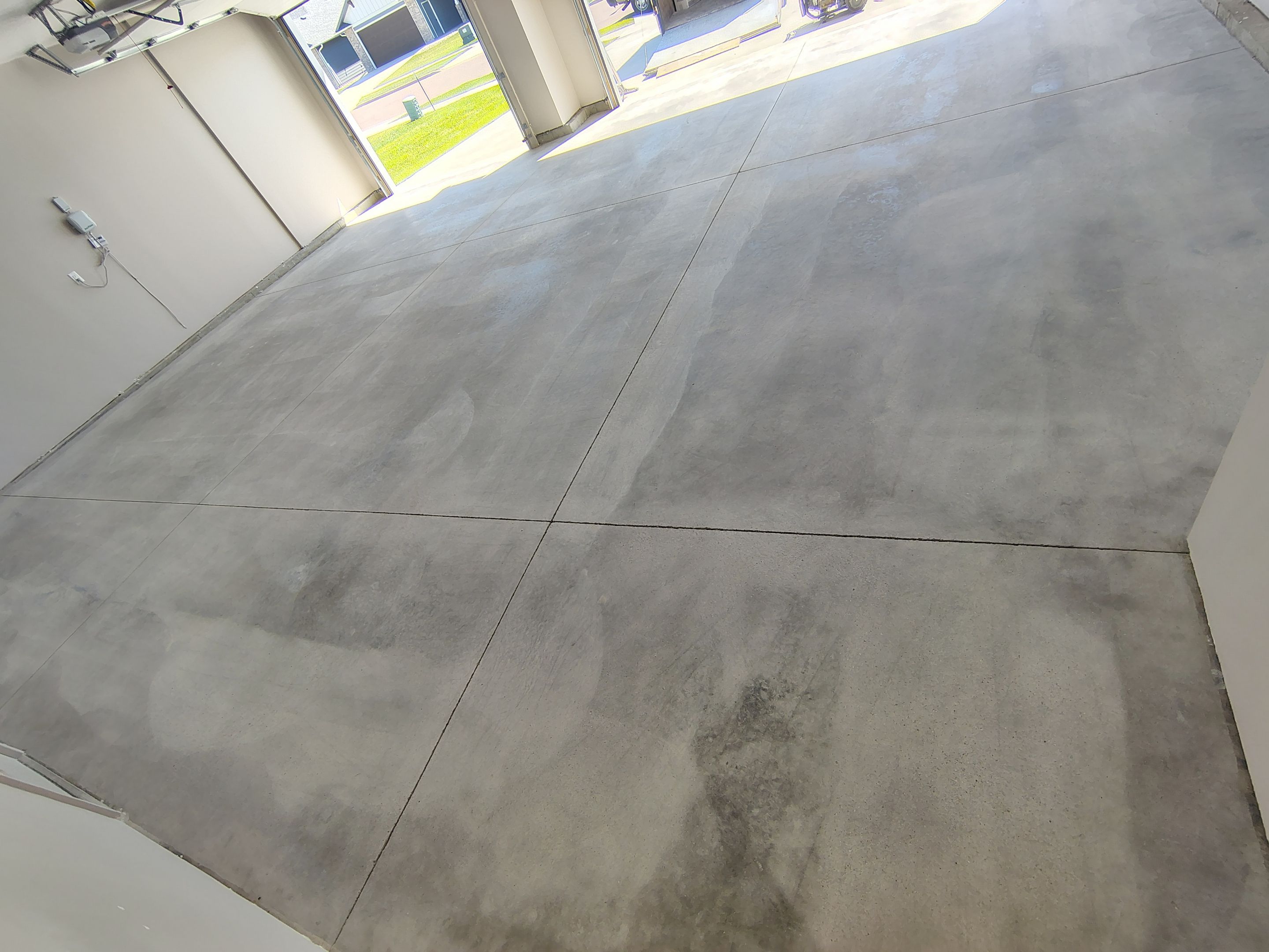 Full Speckled Concrete Coating for Sioux Falls Garage by Select Painting, Coatings & Garage Cabinets