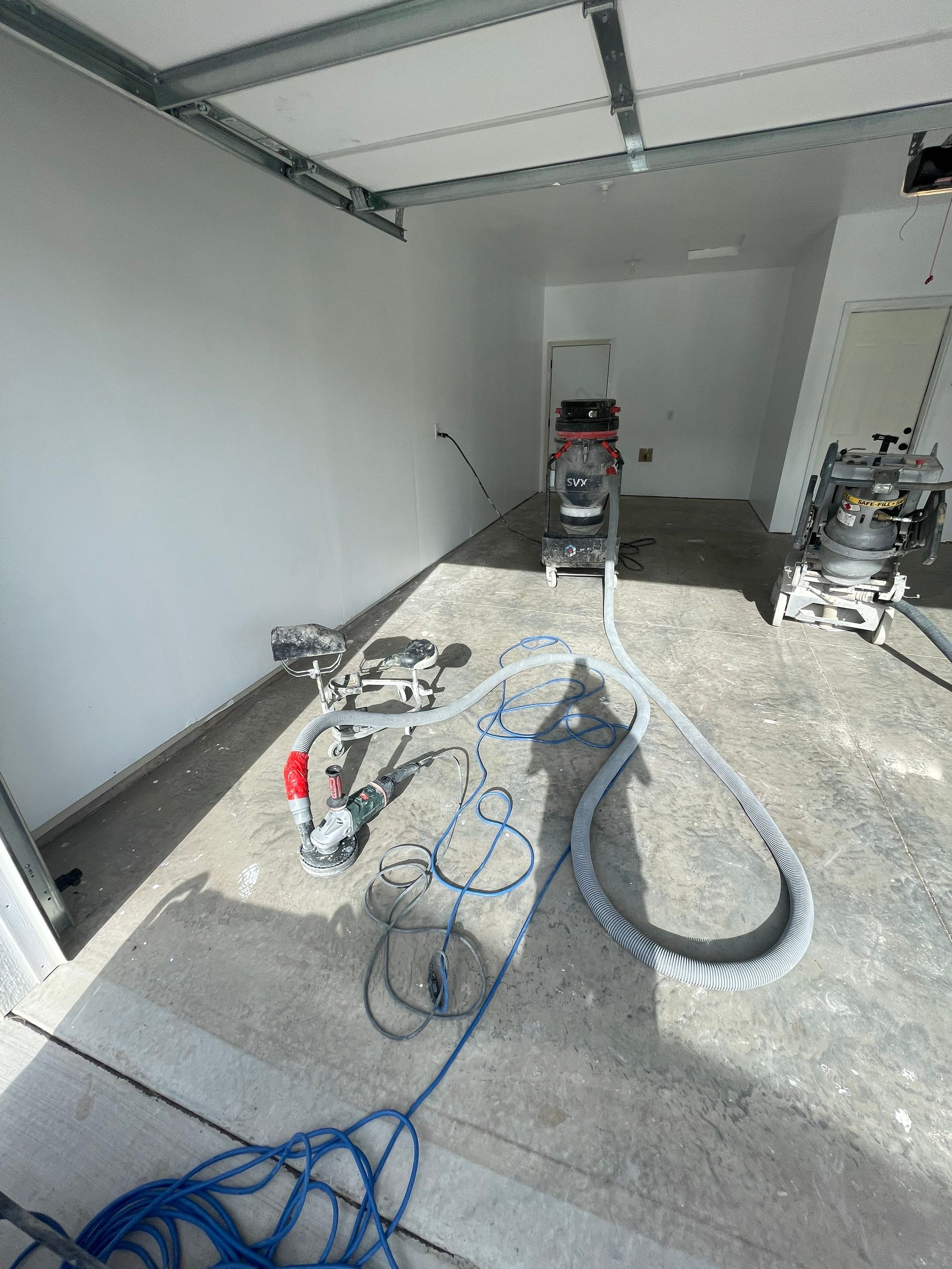 Sioux Falls Garage Floor Transformation with Cabin Fever Decorative Chips by Select Painting, Coatings & Garage Cabinets
