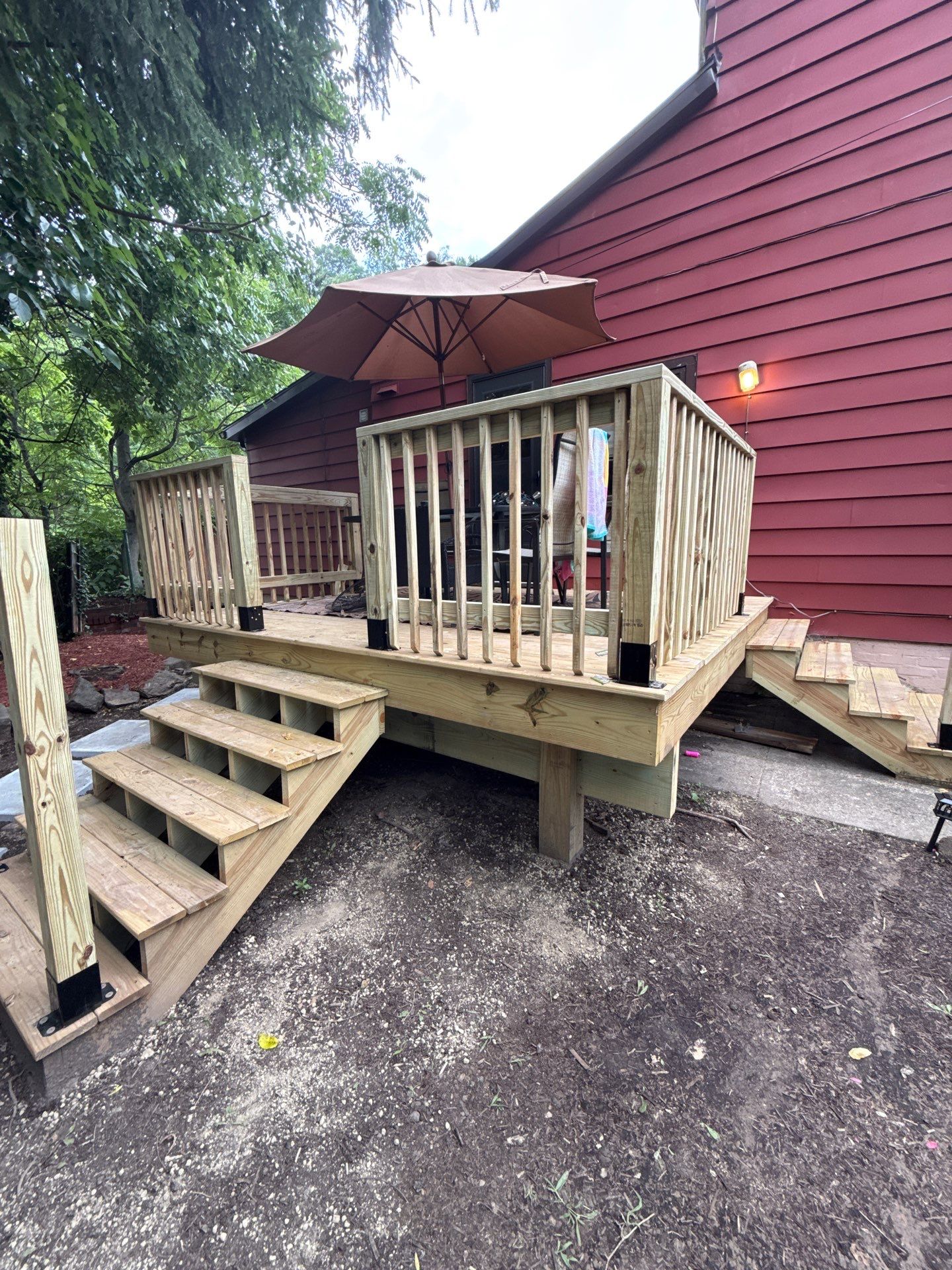 Roof sunspace deck  by Cousins Roofing Siding & Decks