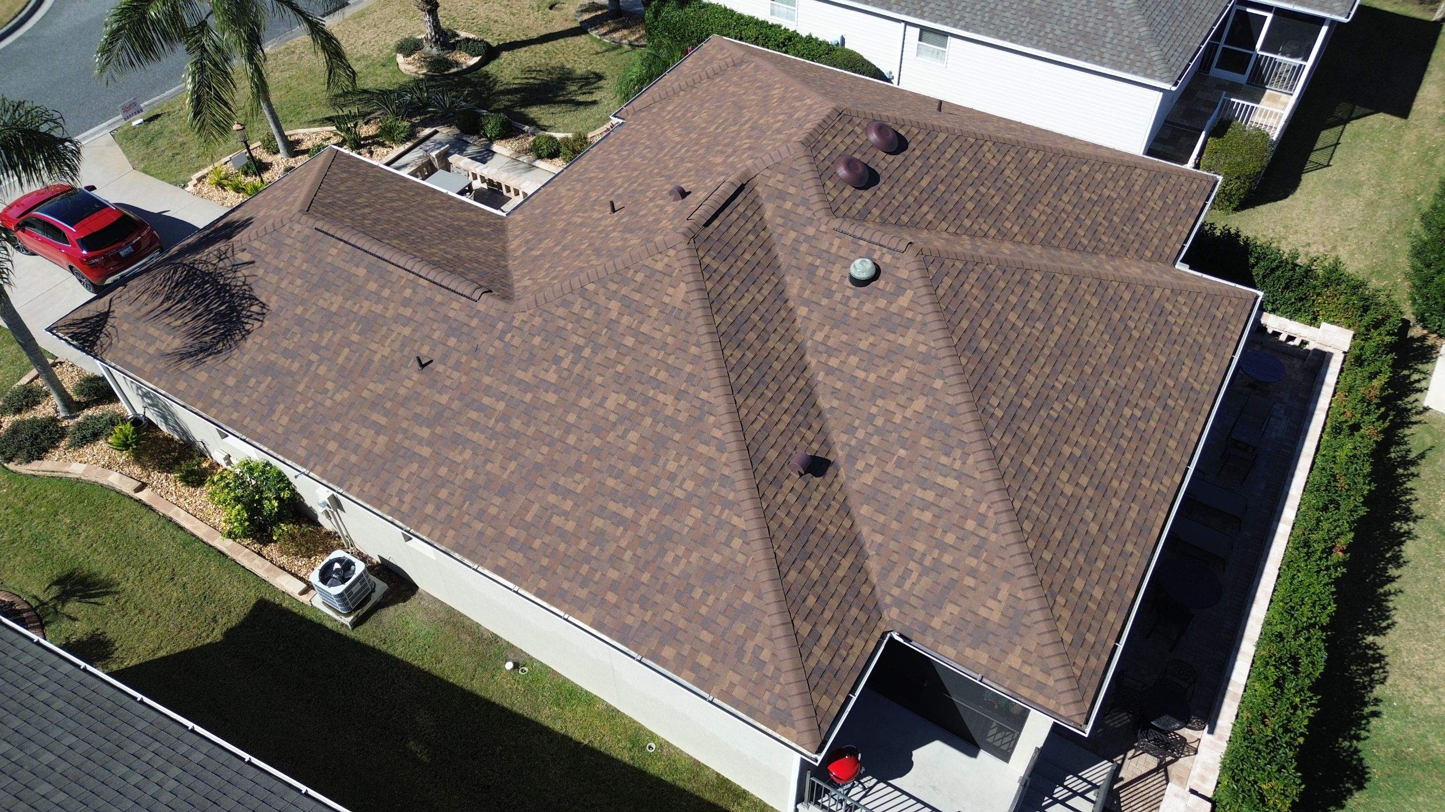 Florida roofers installing shingles by Brehm Roofing