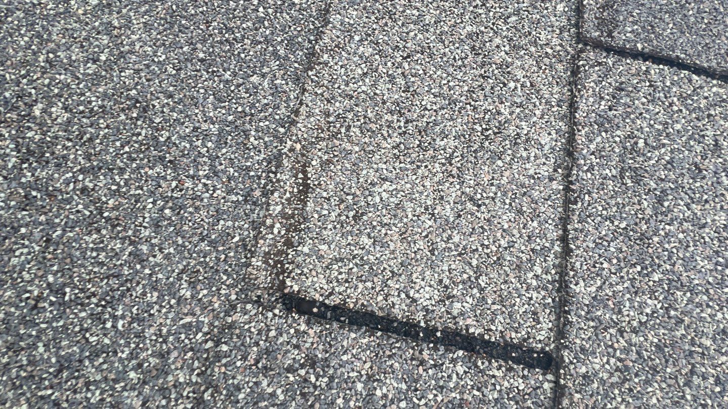 New black gutters and roof by Optimal Home Improvement 