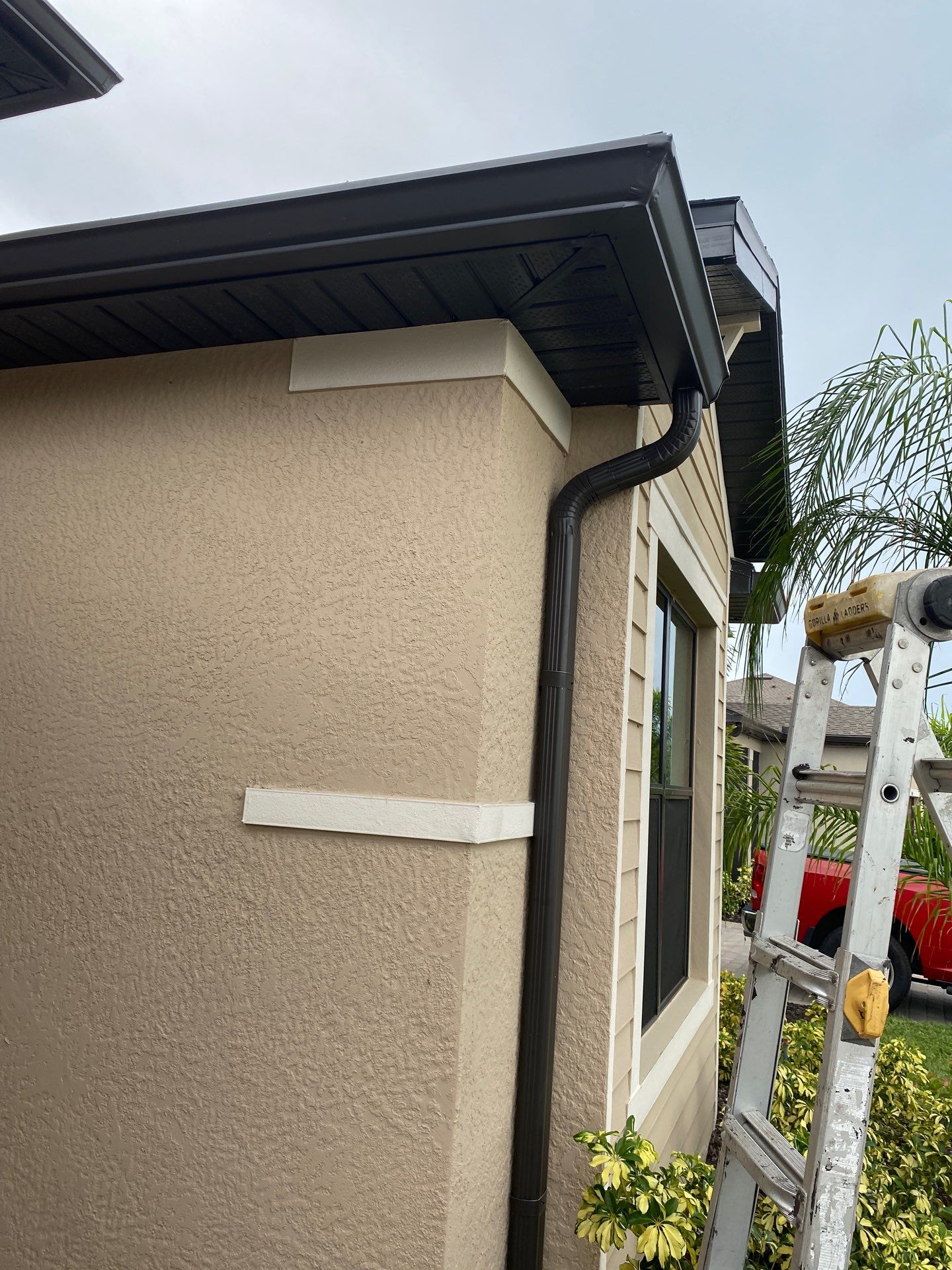 Brown Seamless Gutters for Homes in Fort Myers by Gutter Professors