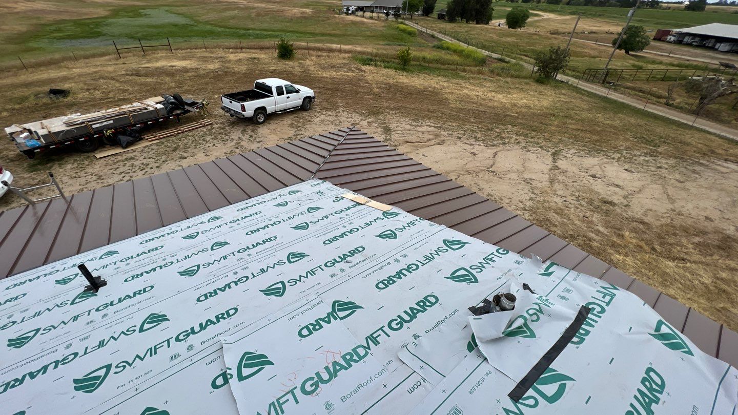 Metal roofing installation using Standing seam metal roofing system by Straight Edge Roofing Inc