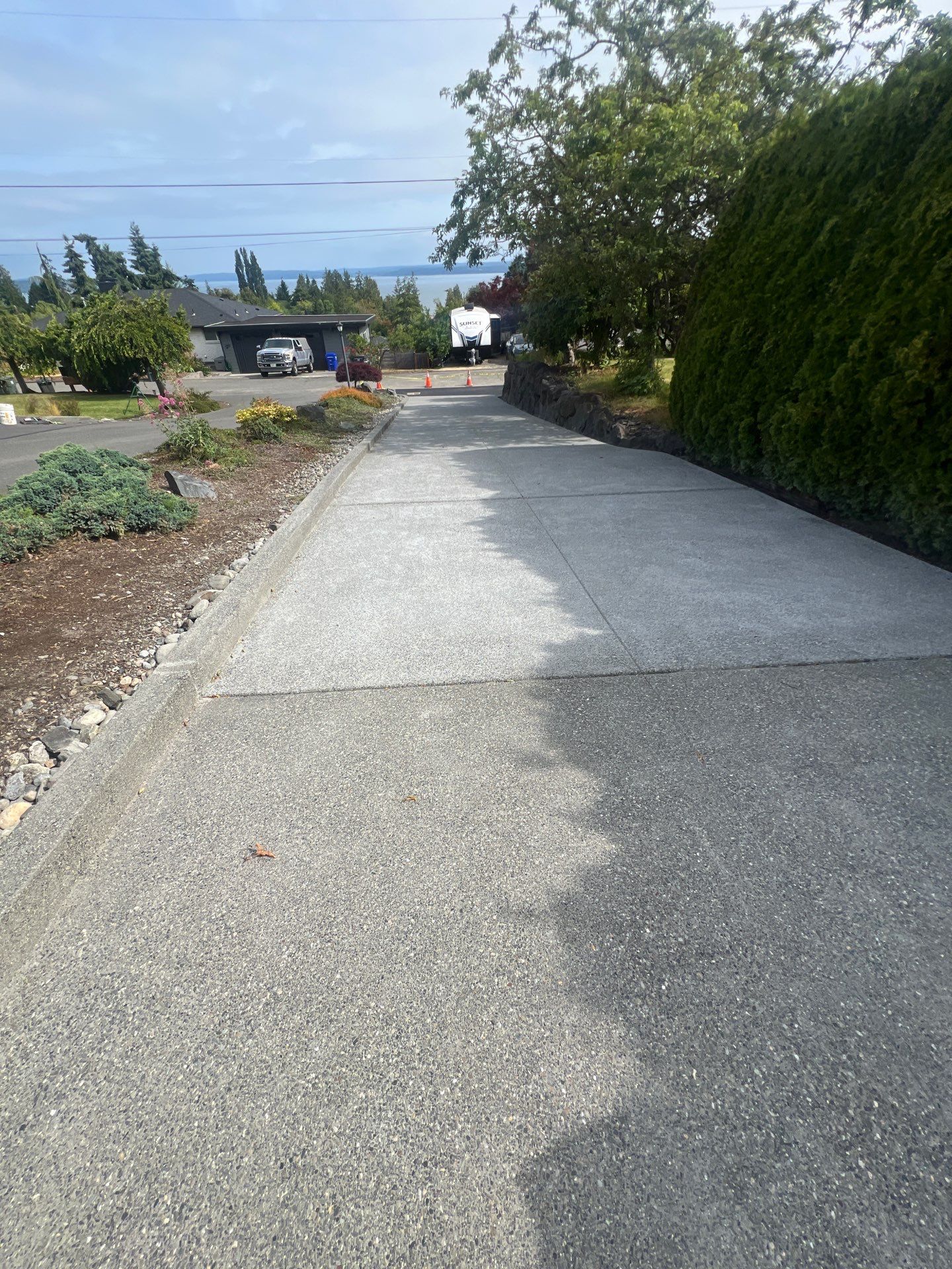 Concrete Driveway Makeover w/ Asphalt Patch | Everett  by Jireh Asphalt & Concrete Inc 