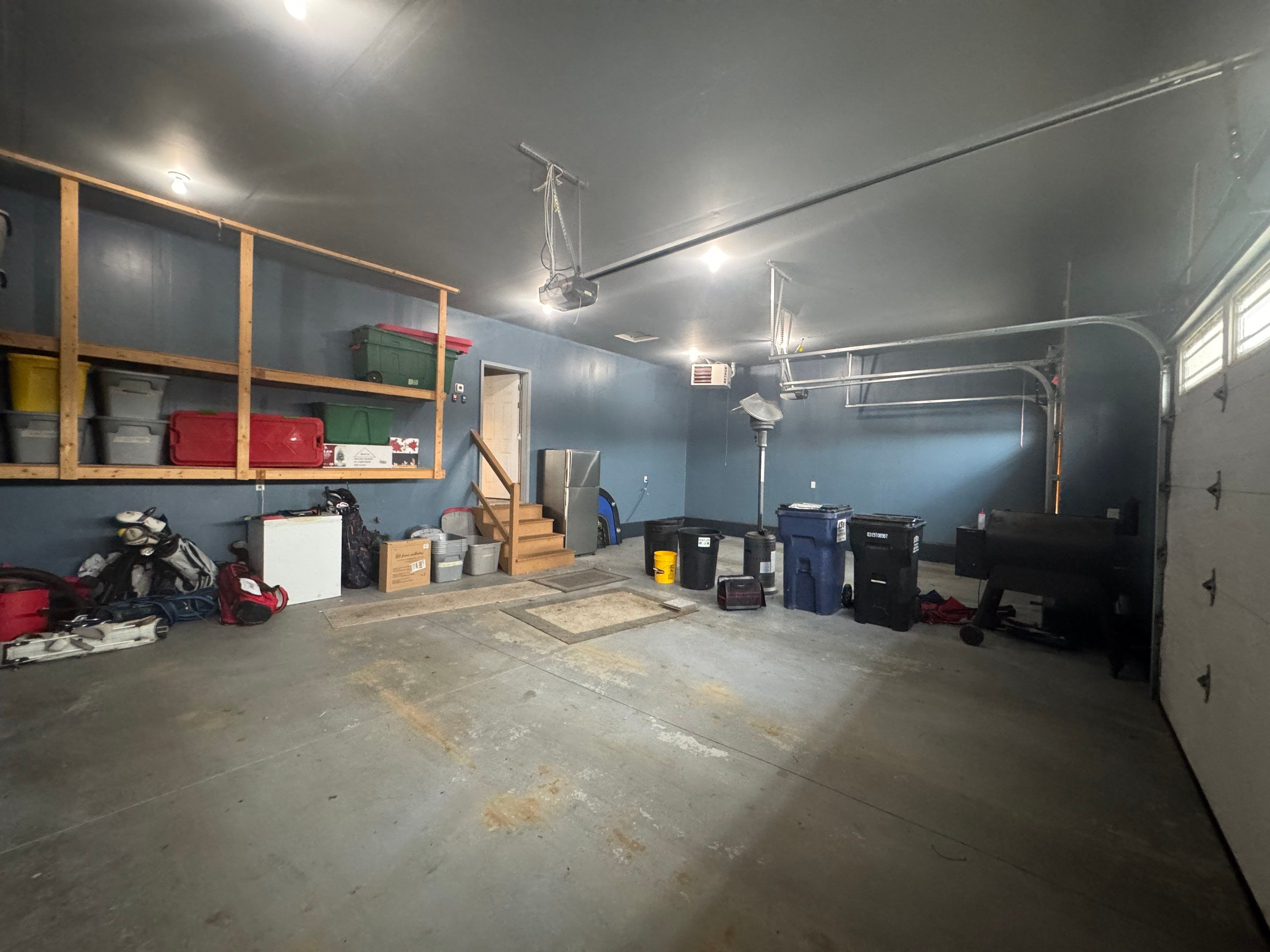 Grey Speckled Epoxy Garage Floor and Stair Coating in Sioux Falls by Select Painting, Coatings & Garage Cabinets
