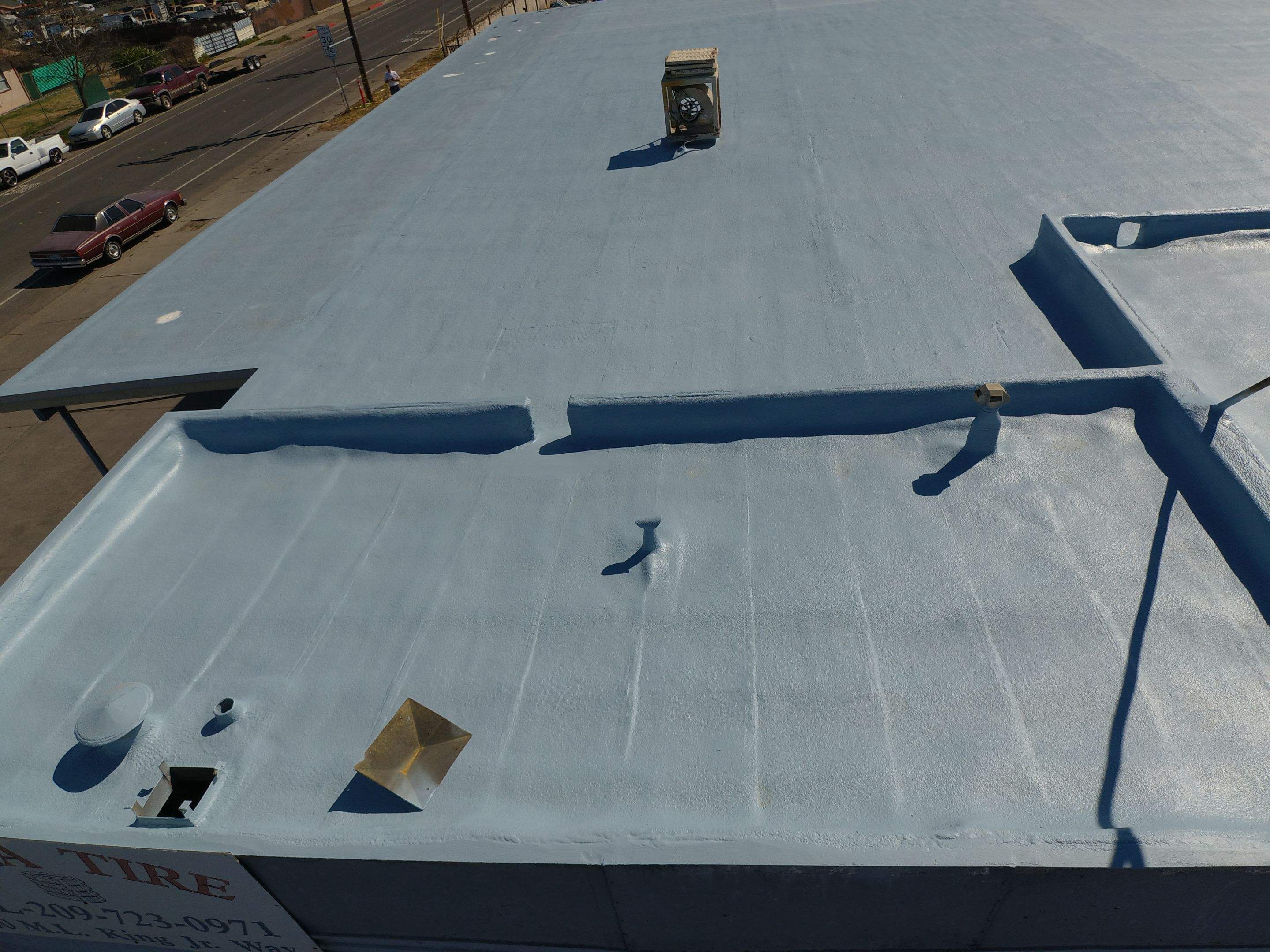 Spray foam and coatings using Conklin Benchmark/PUMA XL coatings and spray foam by Straight Edge Roofing Inc