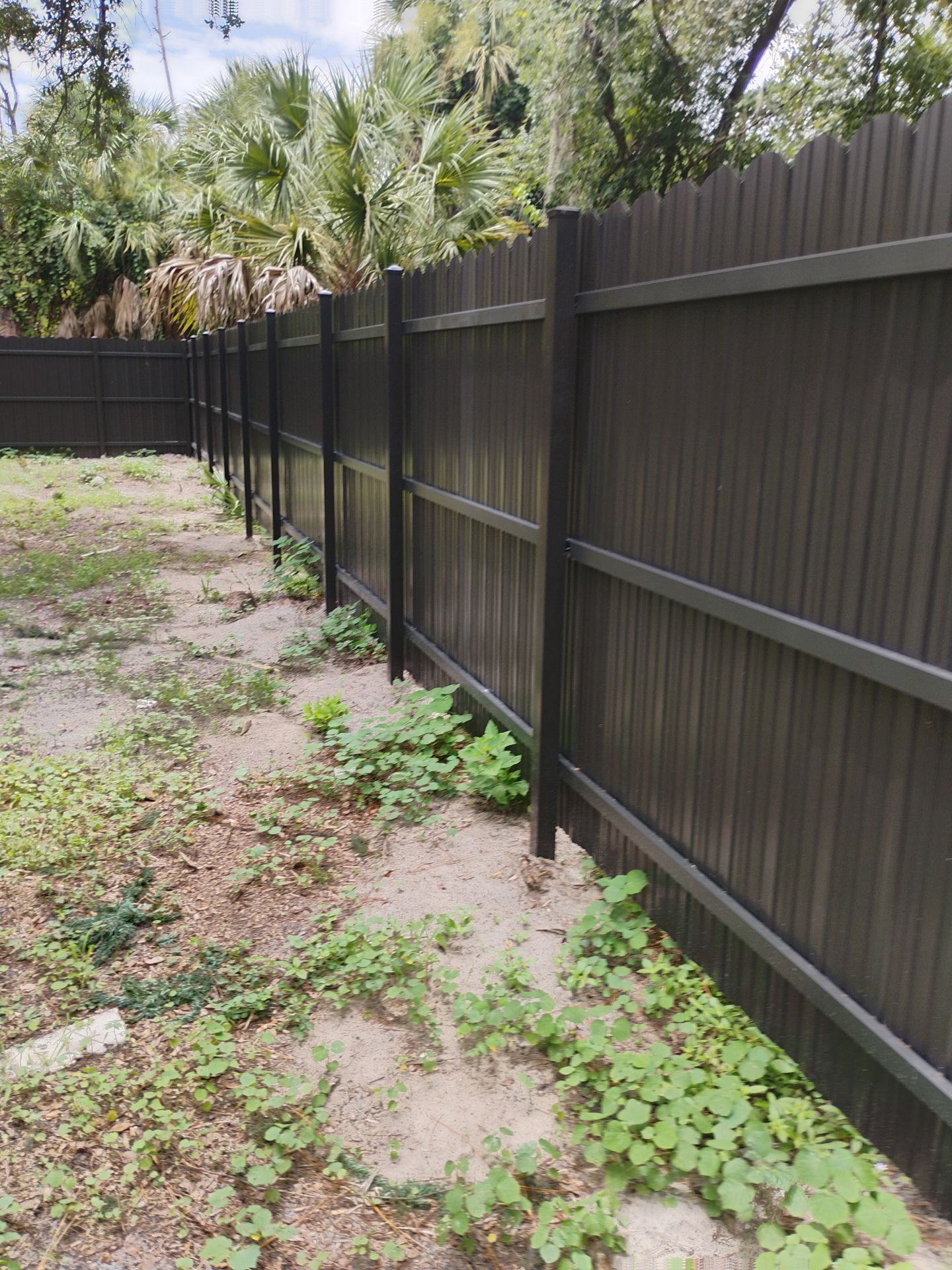 Bronze Scalloped Metal Privacy Fence Installation in North Port by True Fence LLC