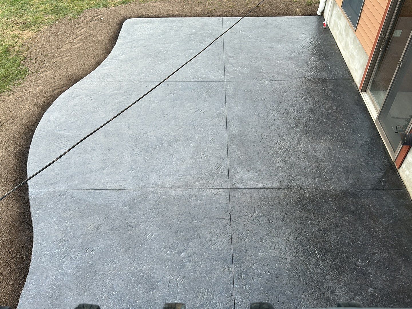 Bluestone textured concrete stamped patio  by NG Masonry & Construction LLC