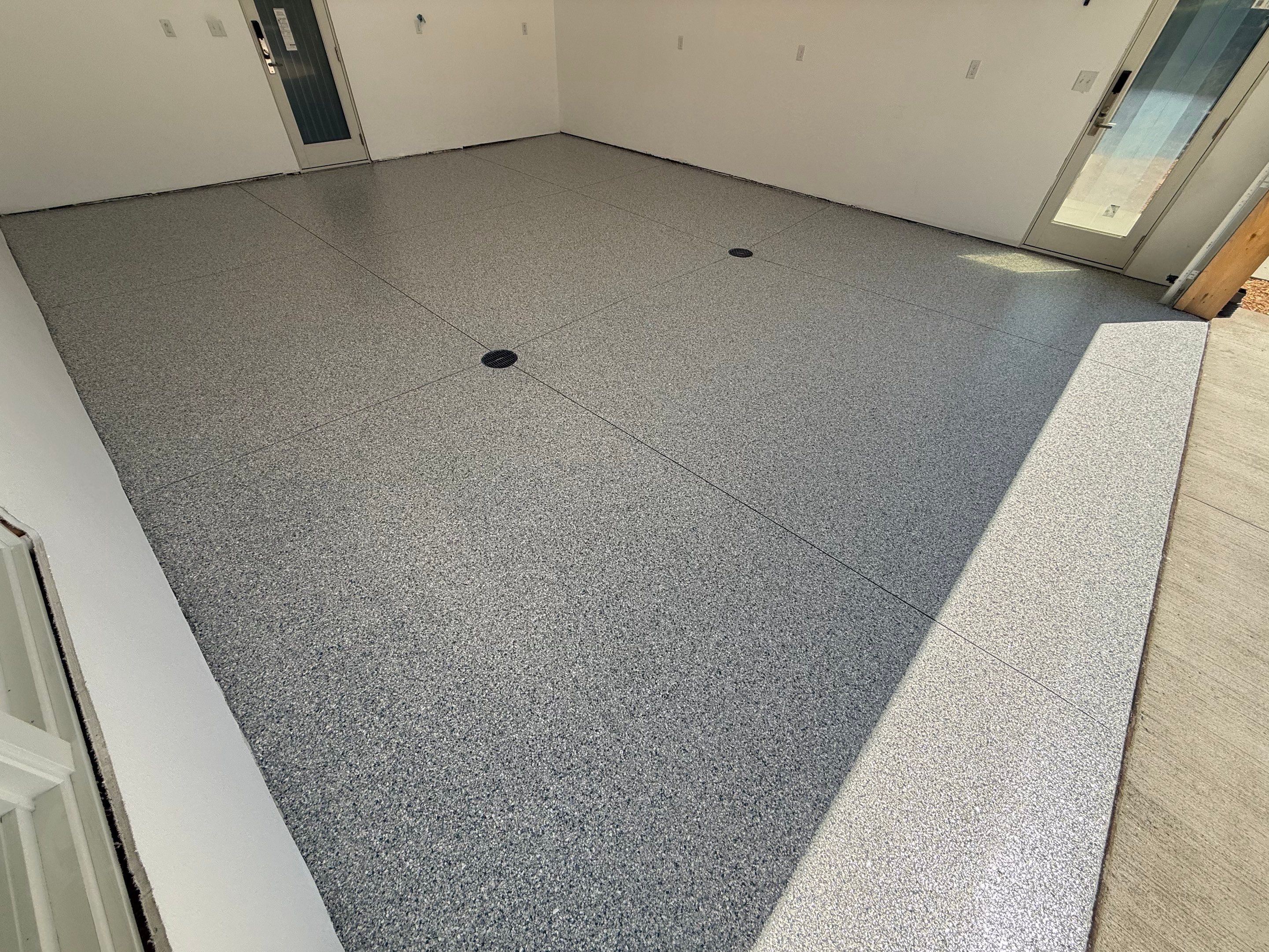 Multi-Car Garage Floor Coating Installation in Sioux Falls by Select Painting, Coatings & Garage Cabinets