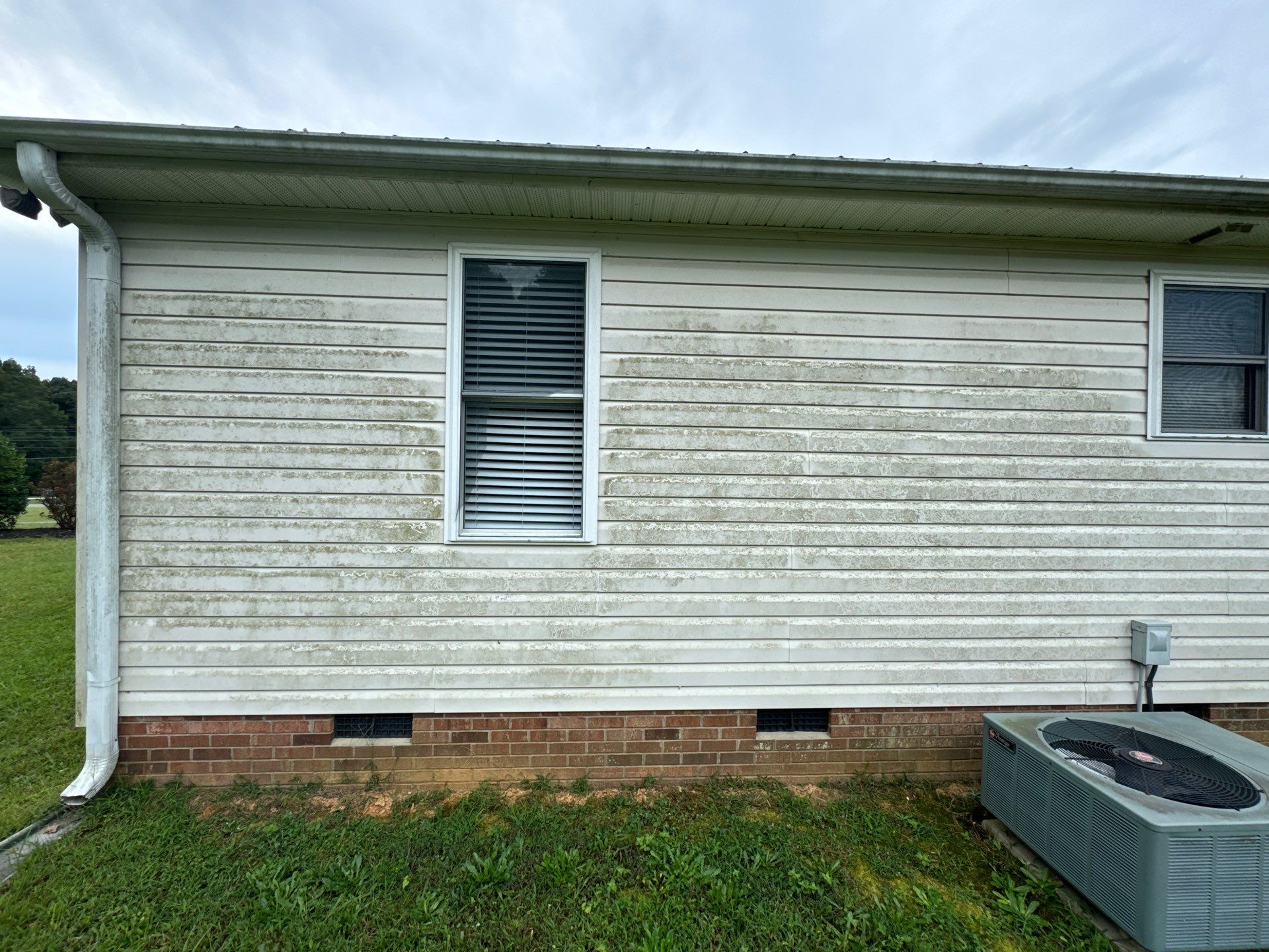 the service shown is cleaning the exterior siding of a house removing dirt and grime for a fresh appearance