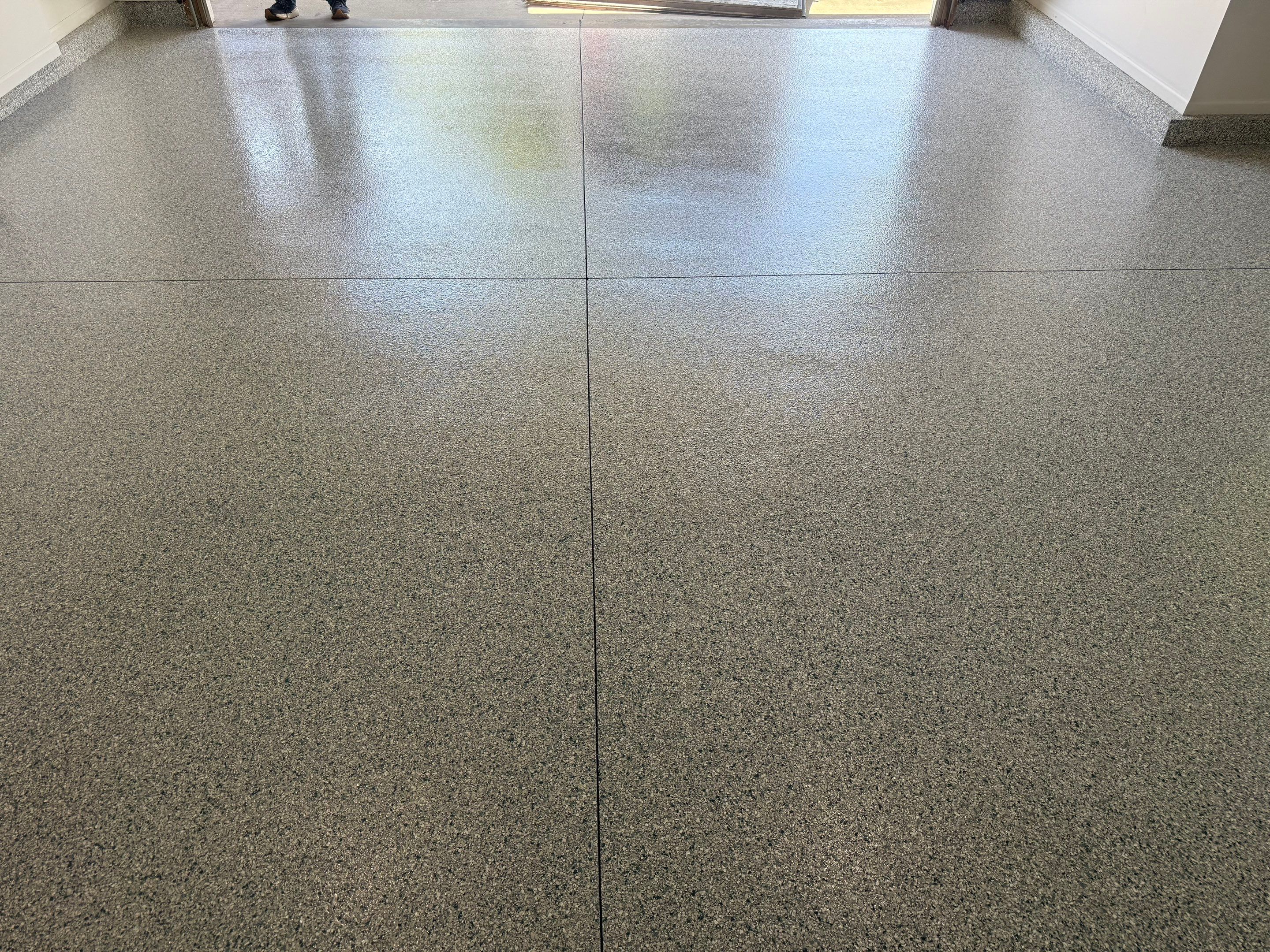 Decorative Chip Epoxy Floor Coating Installation in Sioux Falls by Select Painting, Coatings & Garage Cabinets