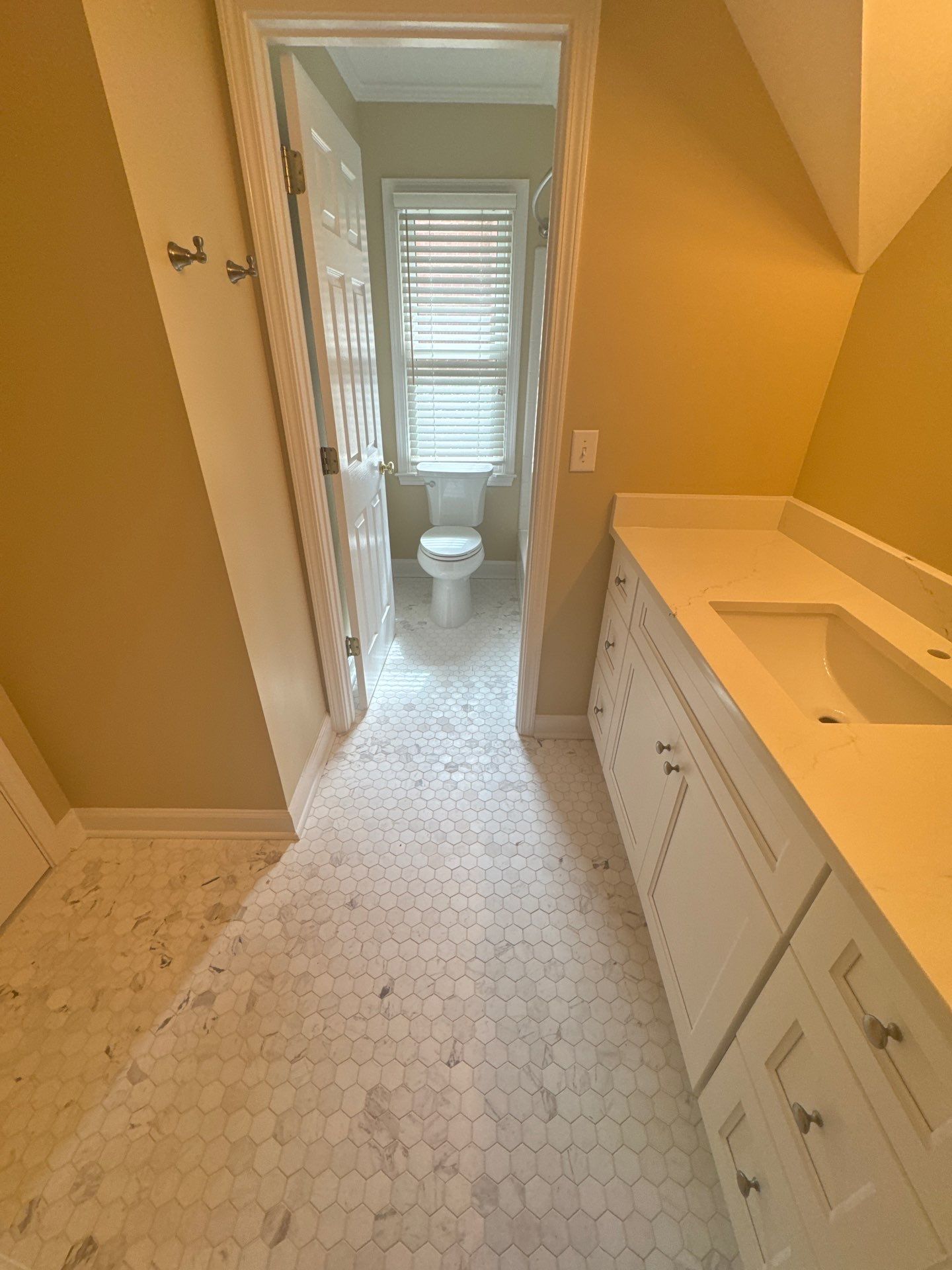 Marietta Bathroom and Laundry Room Floor and Vanity Remodel by Swift Home Renovations