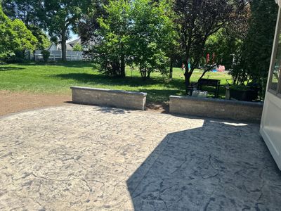 Heavy stone stamped concrete patio and sidewalk