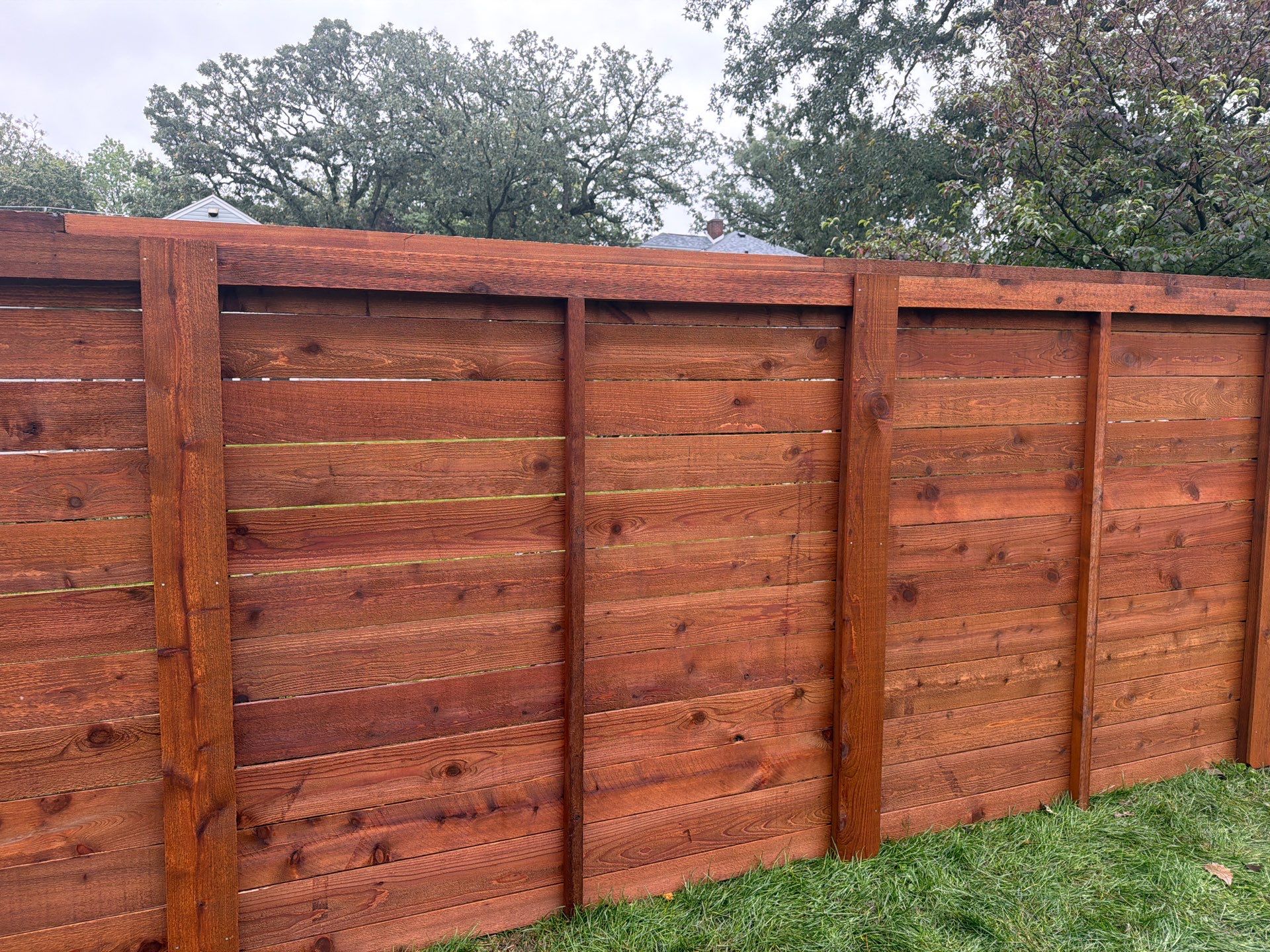 Stained Horizontal Cedar Wood Privacy Fence in Cedar Falls by Perfect Picket Fence and Stain