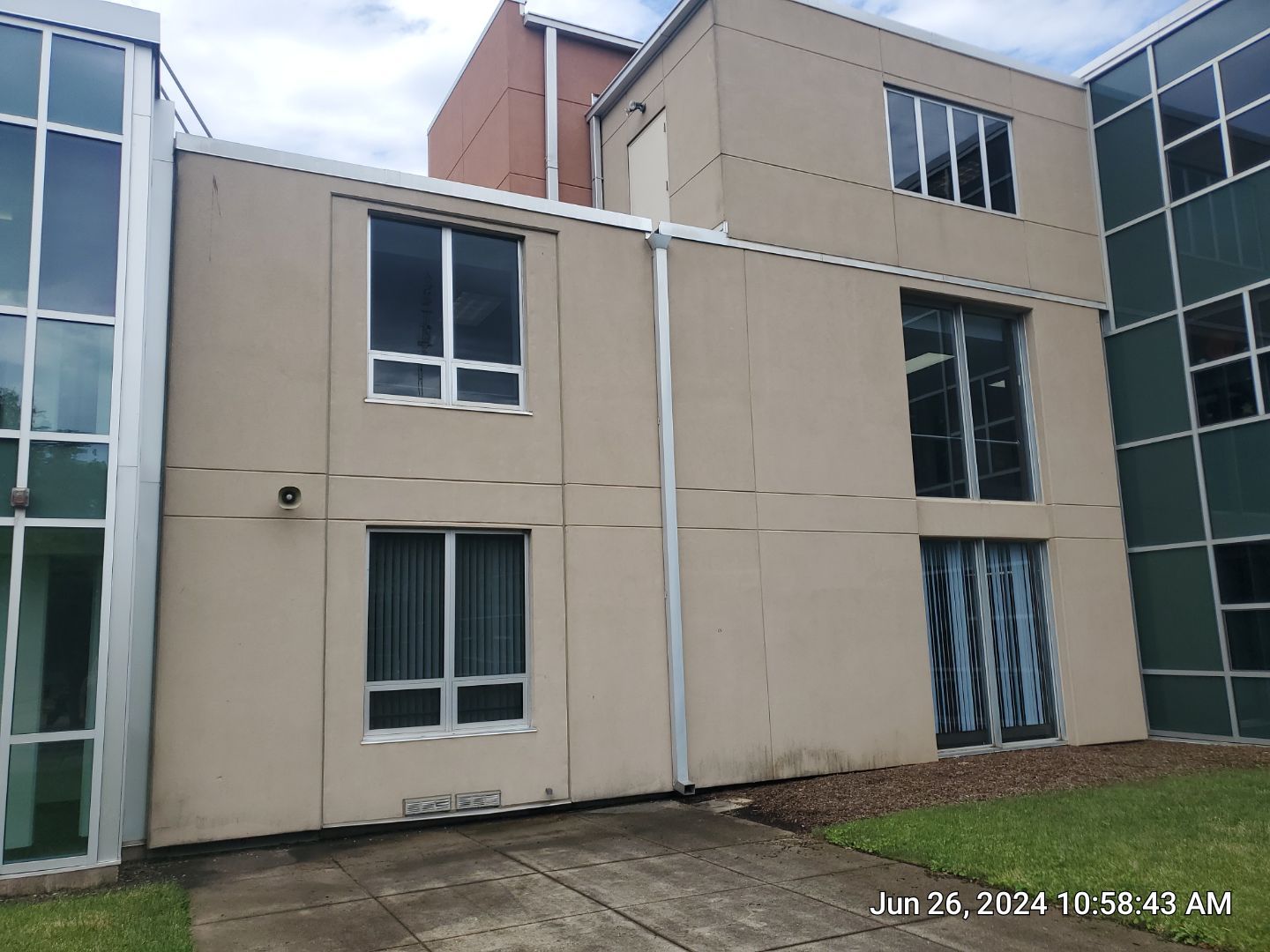 concrete using Algaecide, soft wash soap by Northern Power Washing LLC.