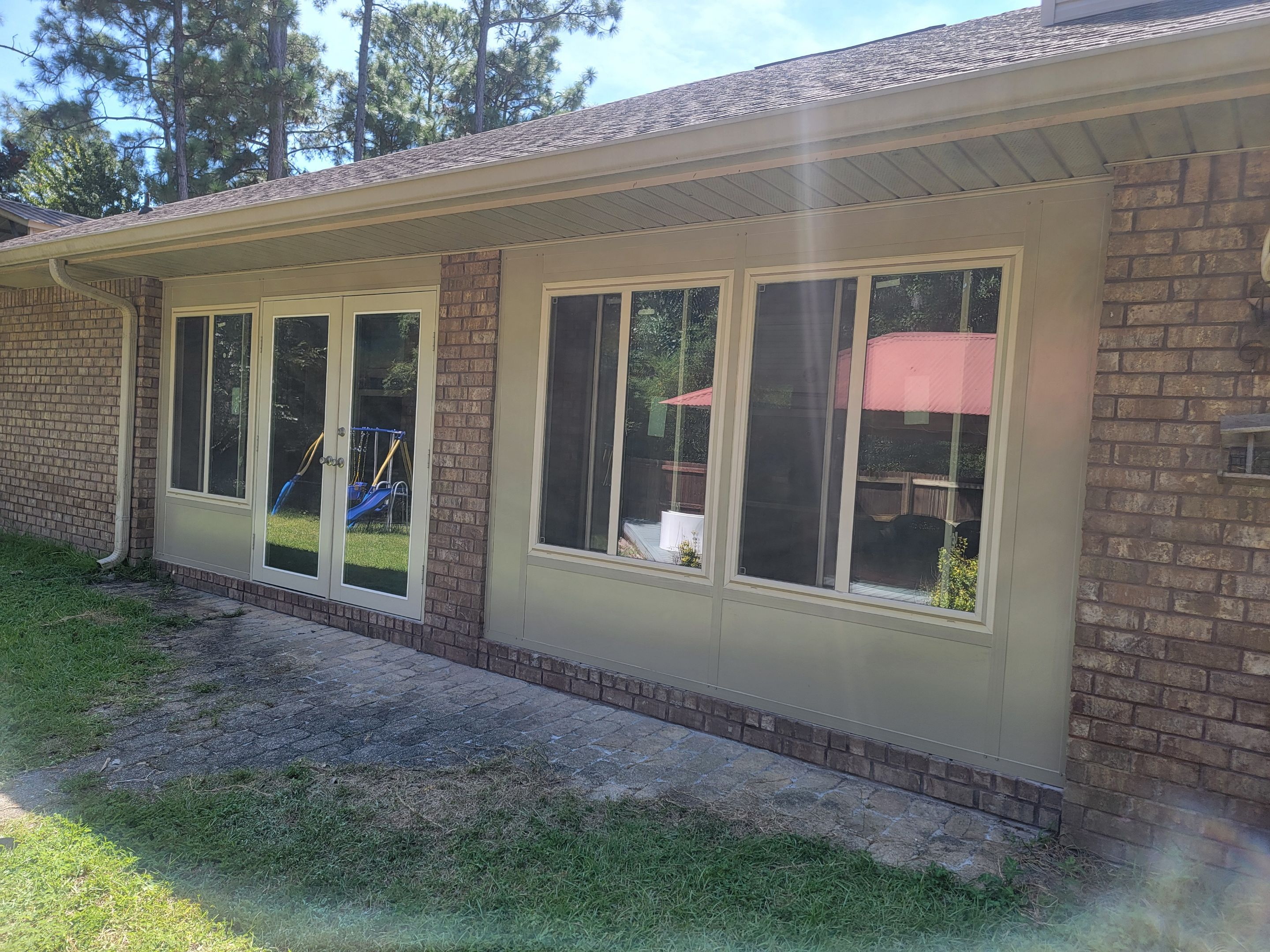 Glass Sunroom Constructed Under Existing Roof by Titan Sunrooms