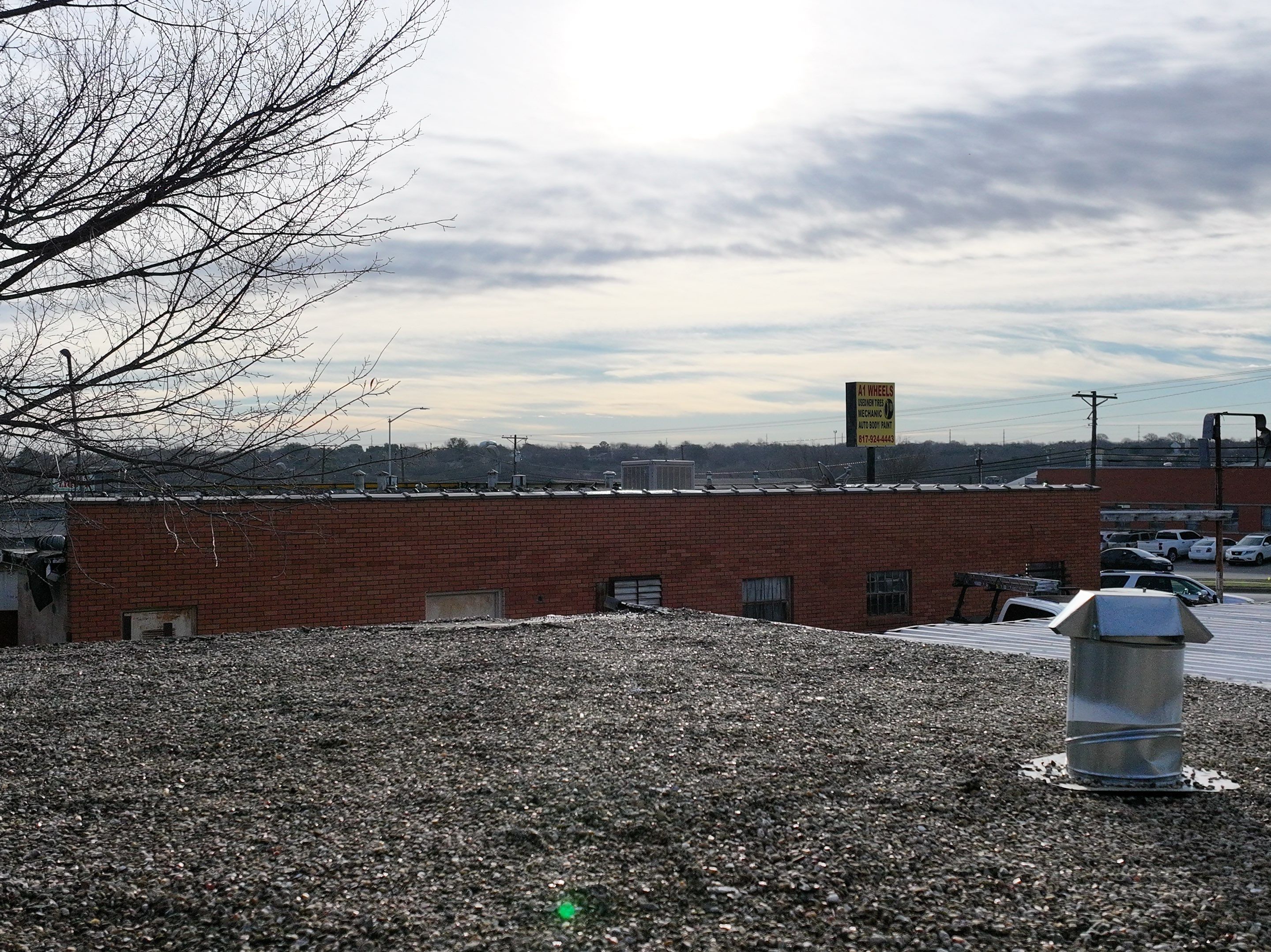 Commercial roofing overlay using GAF TPO over an old ballast roof by Becker Roofing and Exteriors