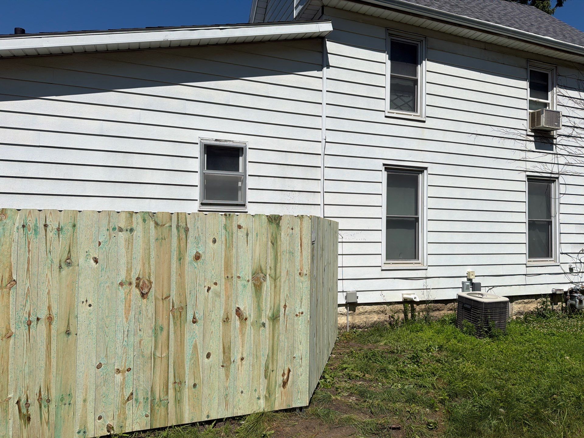 Pressure-Treated Wood Privacy Fence Installation in Waterloo by Perfect Picket Fence and Stain