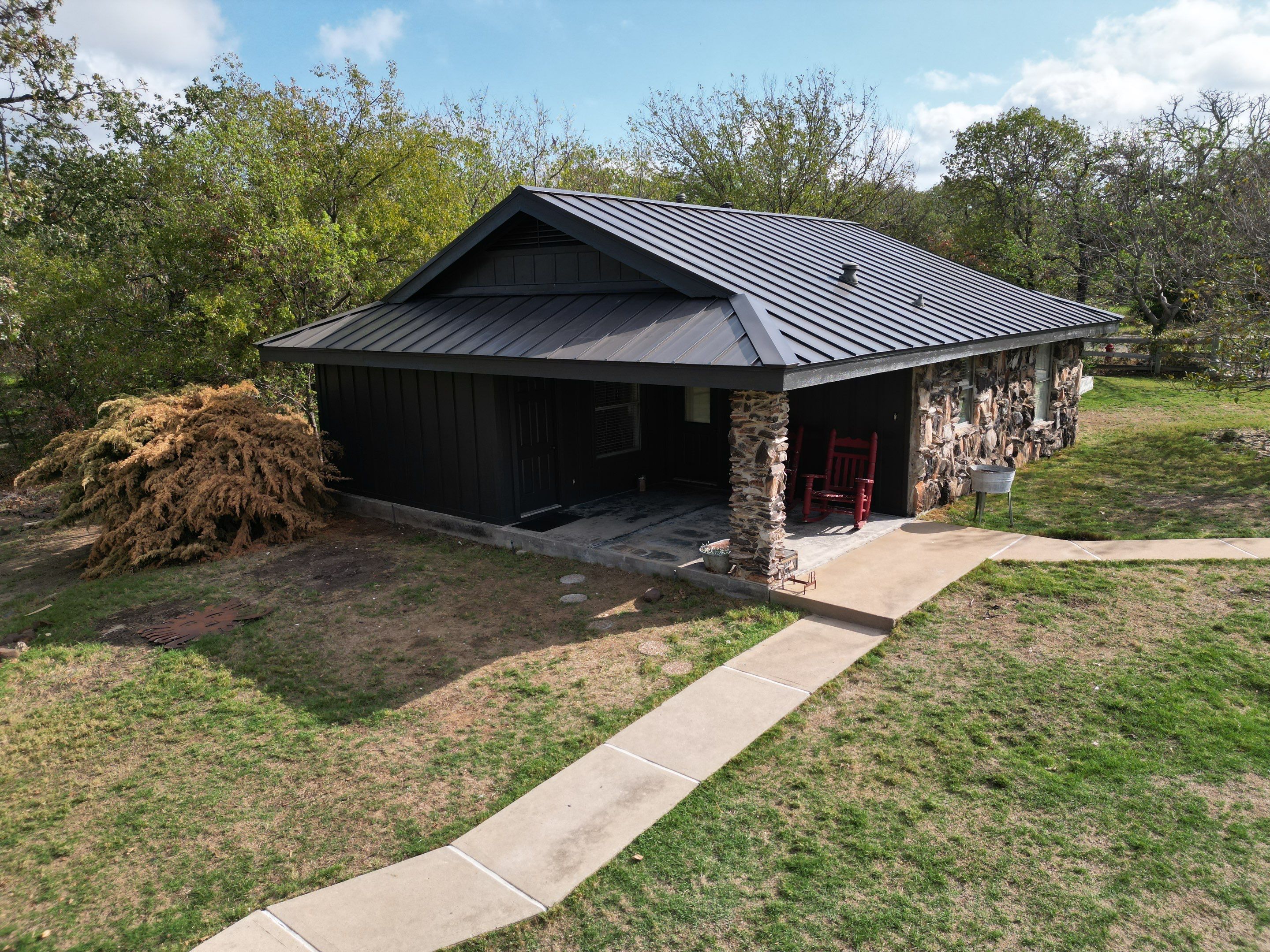 Dark Bronze Standing Seam Metal Roof by First Out Roofing 