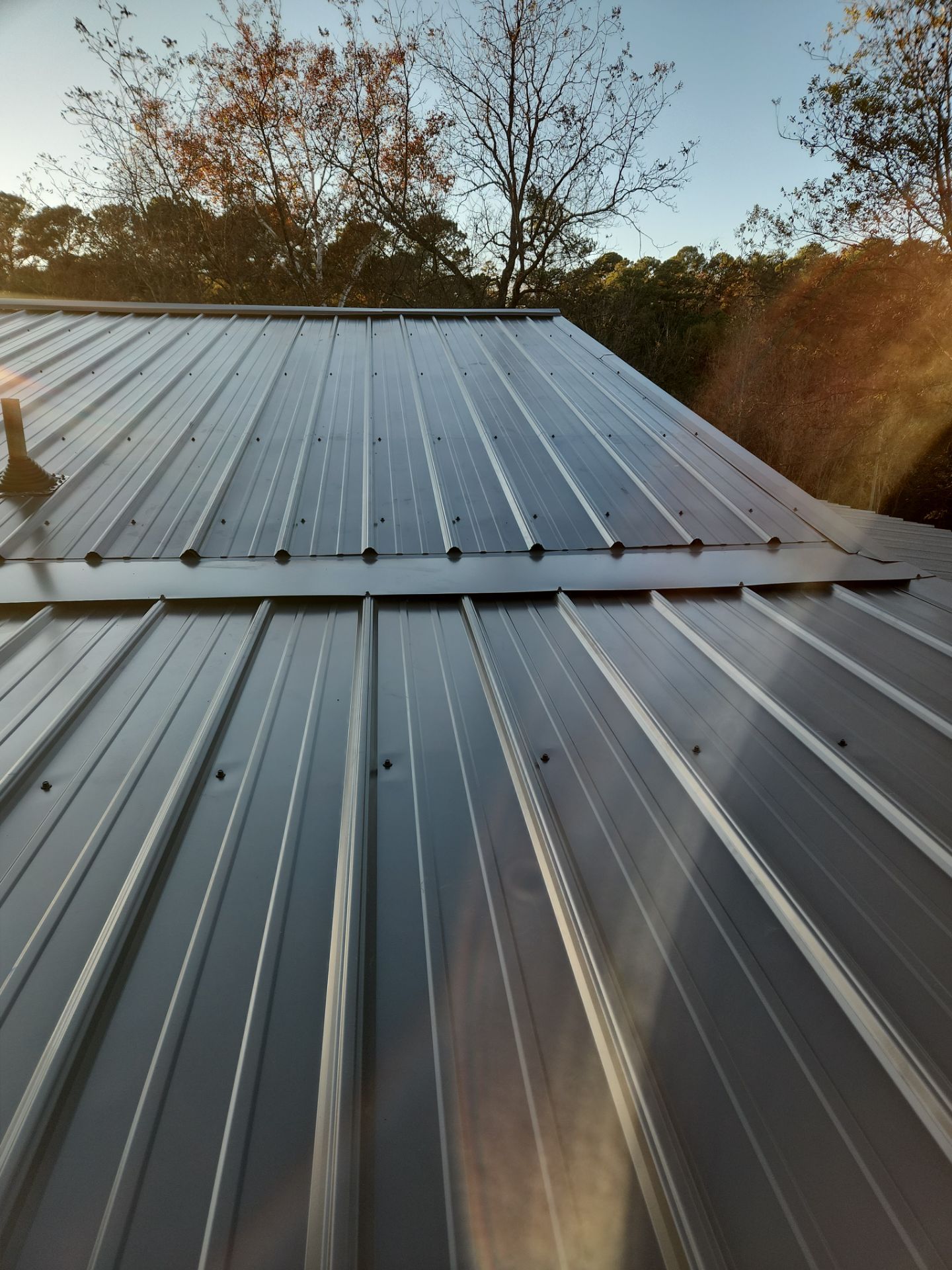 Roof Replacement in Pinson (Metal Roof) by The Roofing Dudes