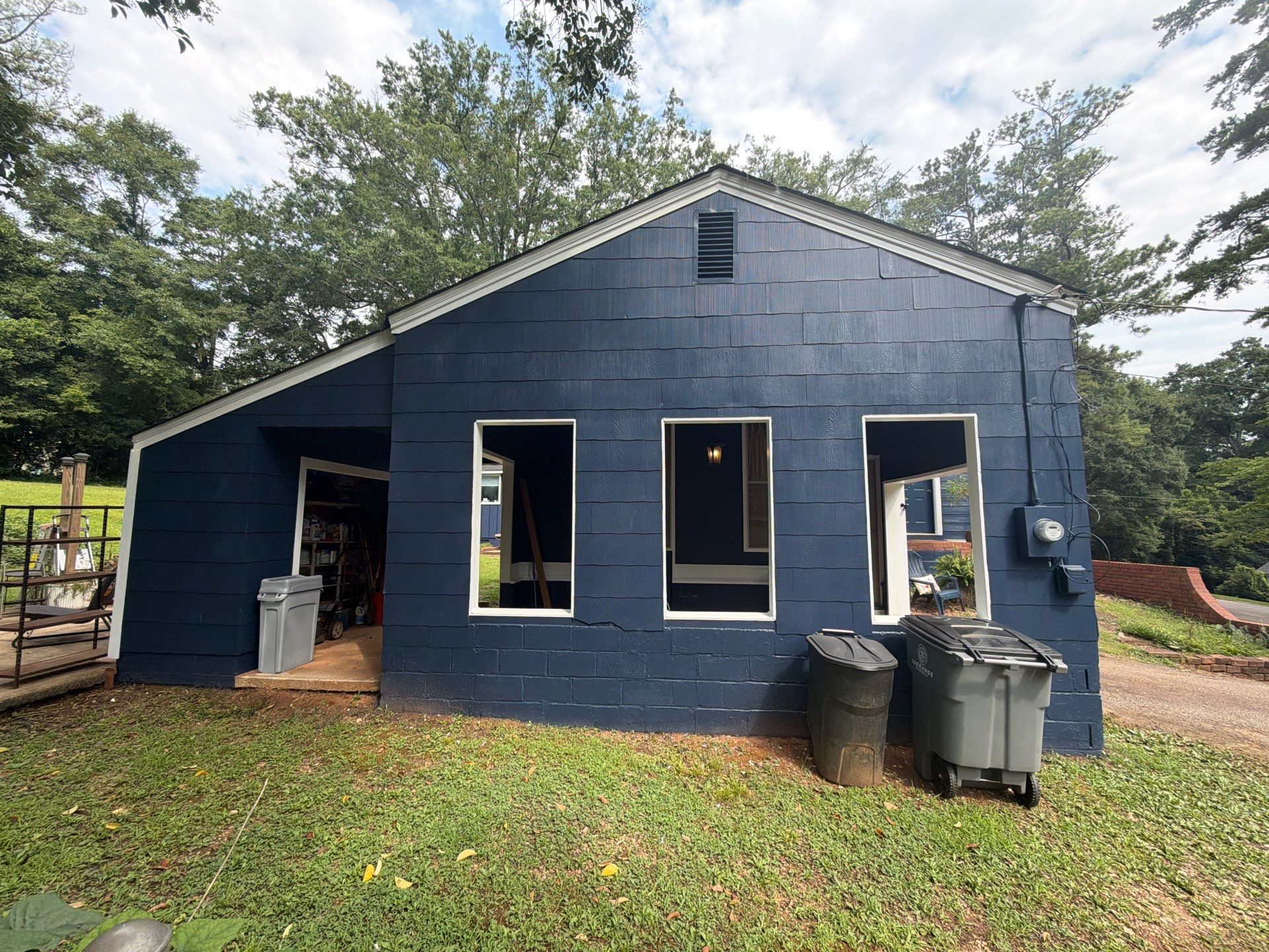 Full Exterior Repaint with Navy Blue and White Trim by Swift Home Renovations