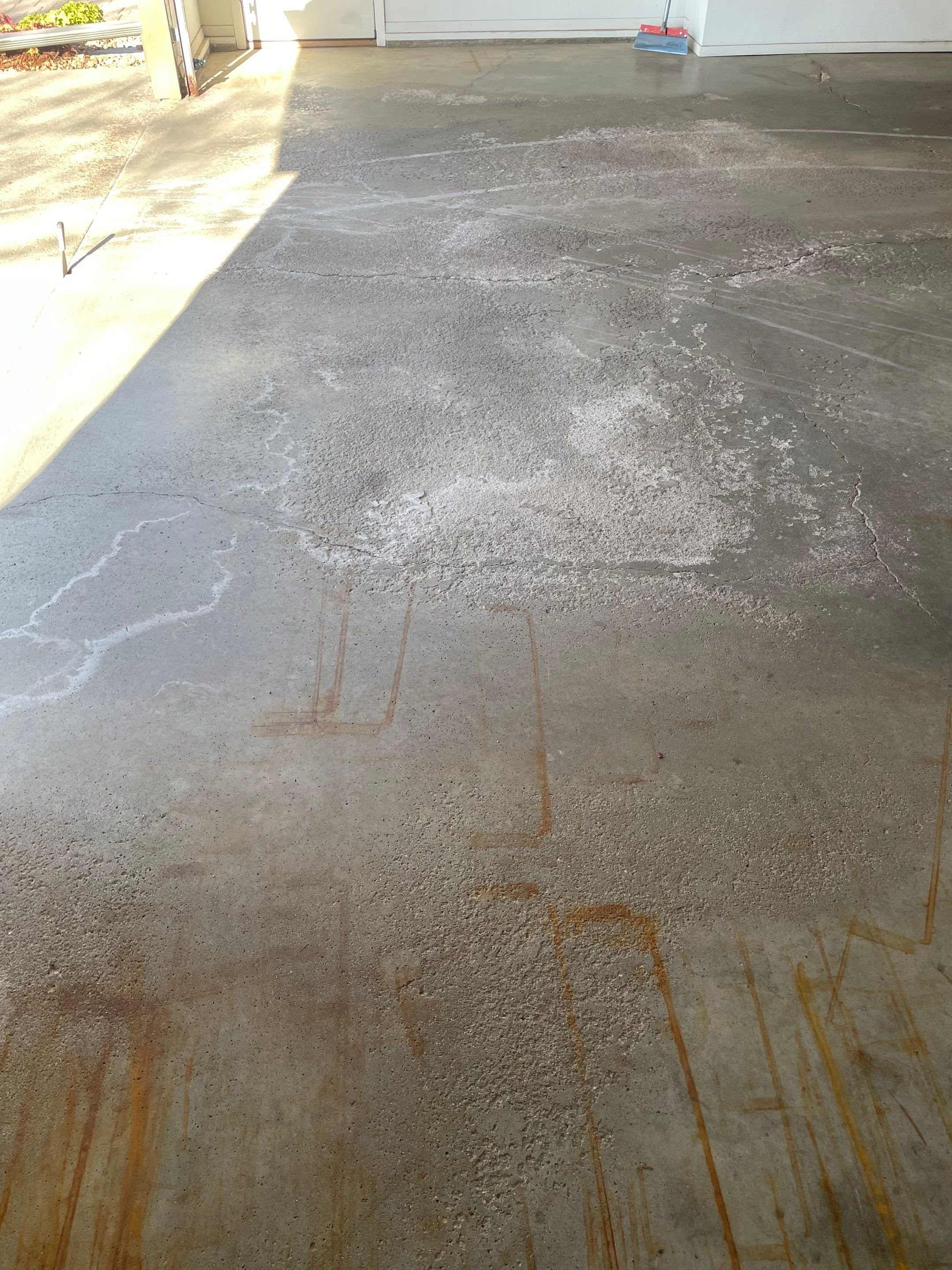 Yankton Garage Floor Restoration with Gray Speckled Epoxy Coating by Select Painting, Coatings & Garage Cabinets